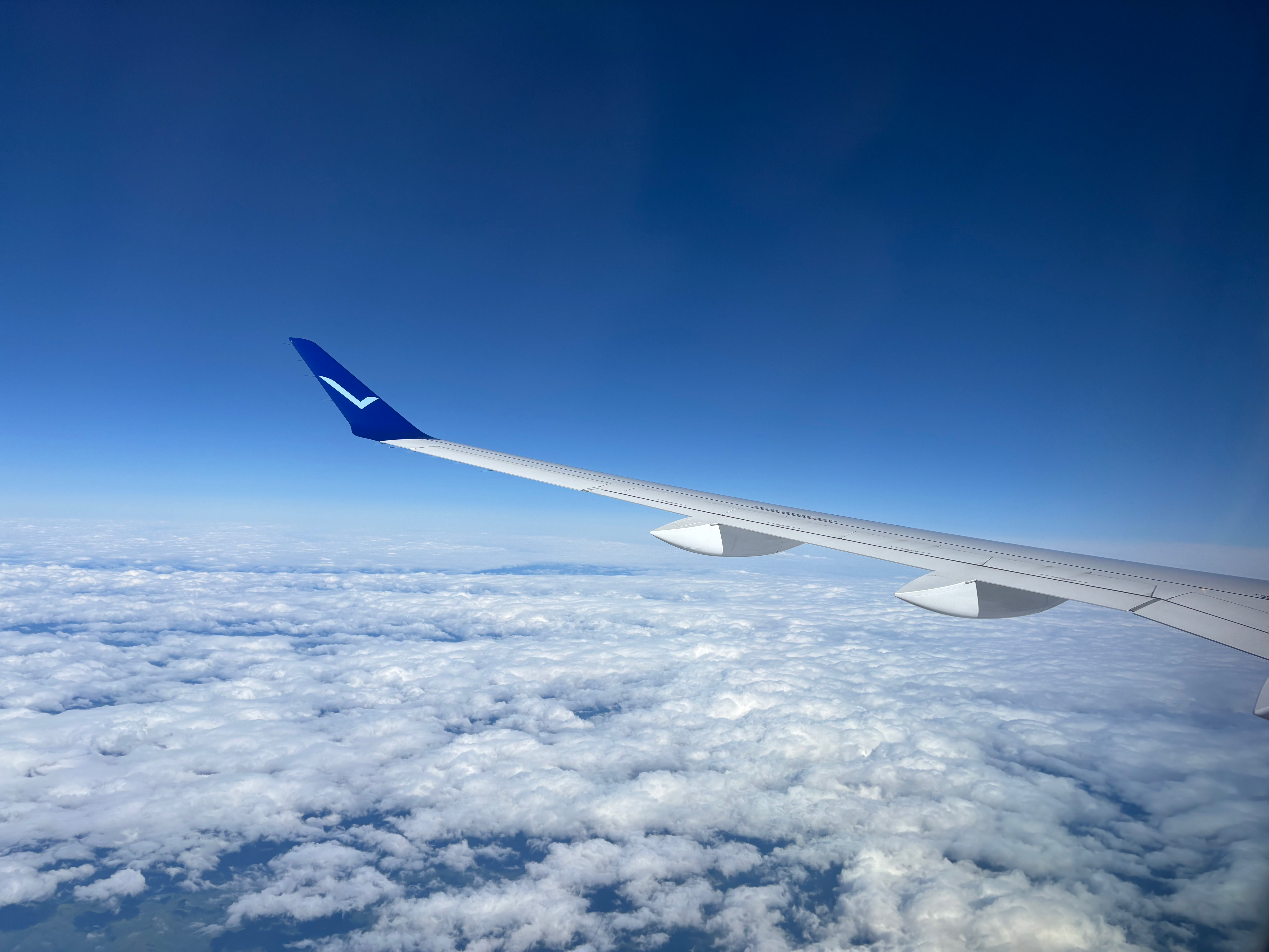 an airplane wing in the sky