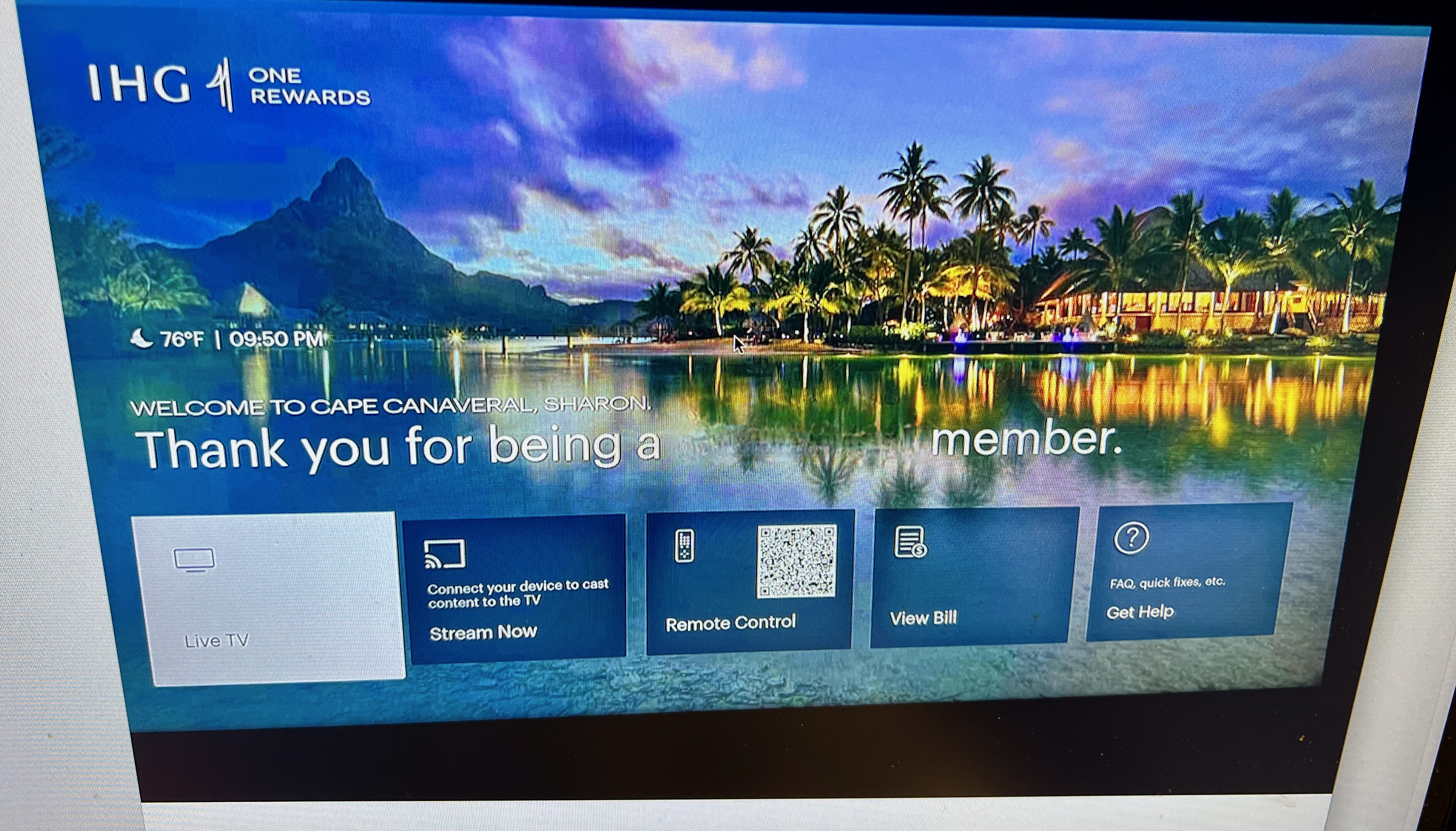 a computer screen with a picture of a beach and mountains