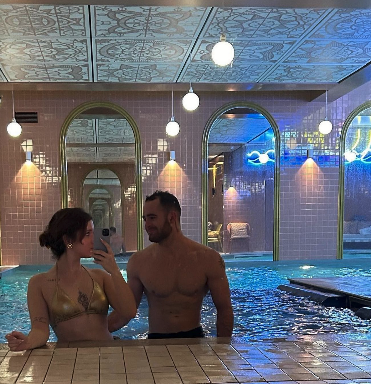a man and woman in a pool