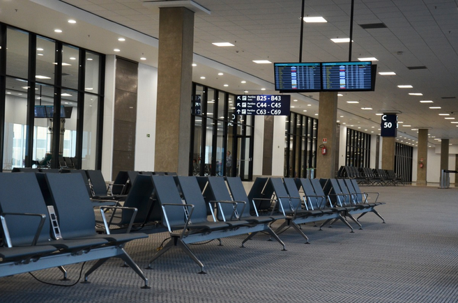 a row of chairs in an airport terminal