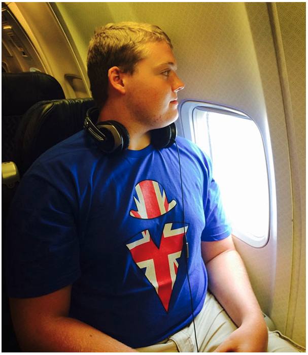 a man sitting in an airplane with headphones on