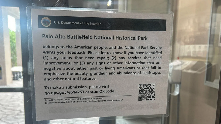 a sign on a glass wall