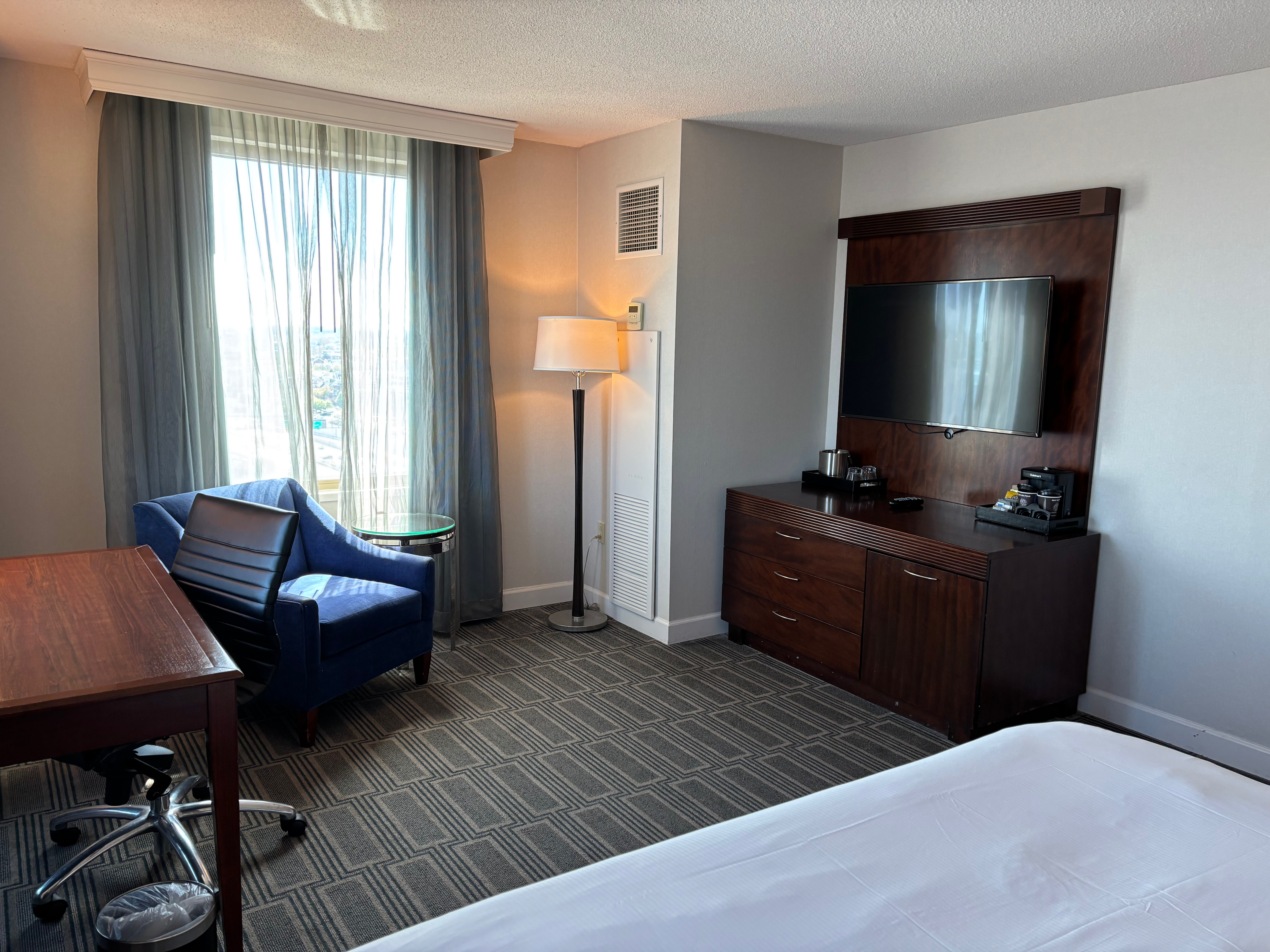 a room with a tv and a chair