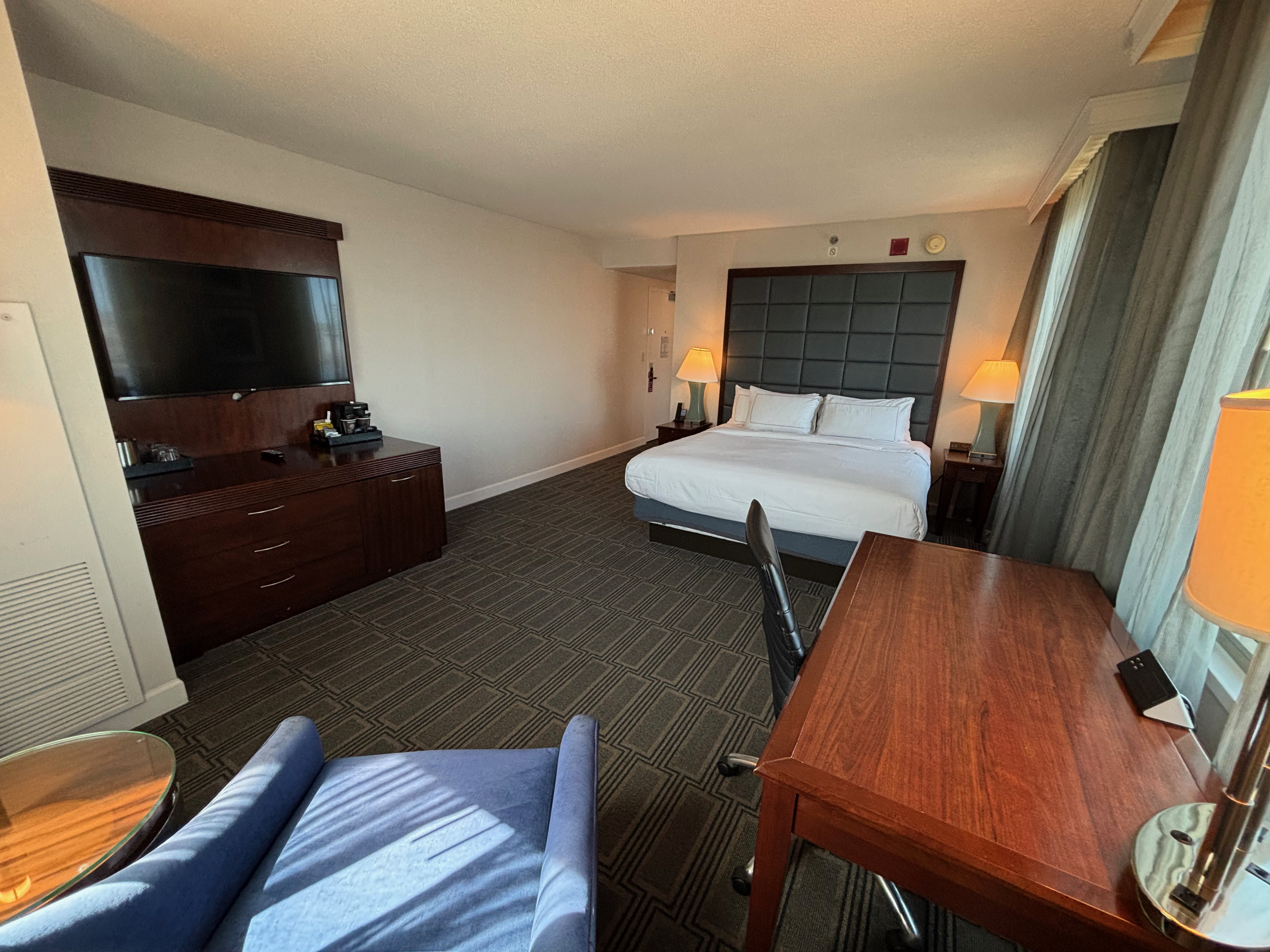 a room with a bed and a desk