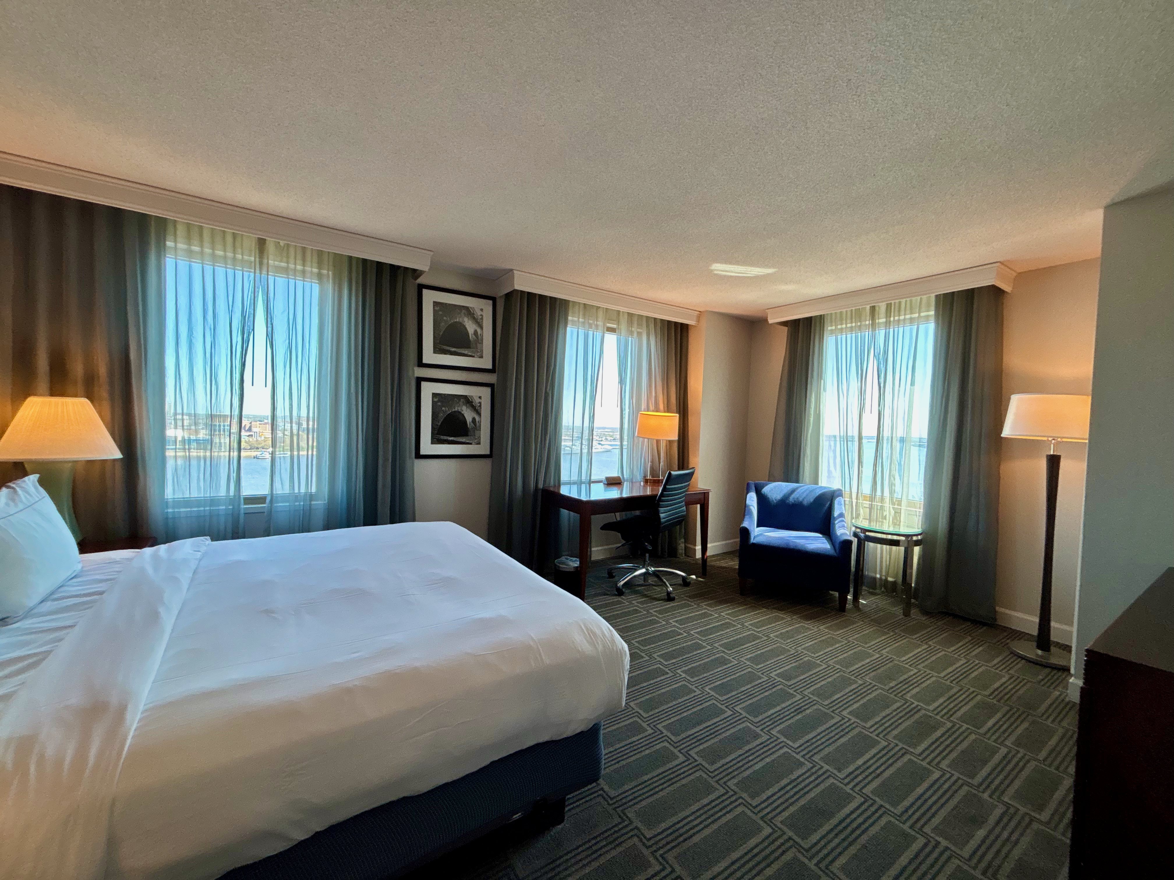 a room with a bed and a chair