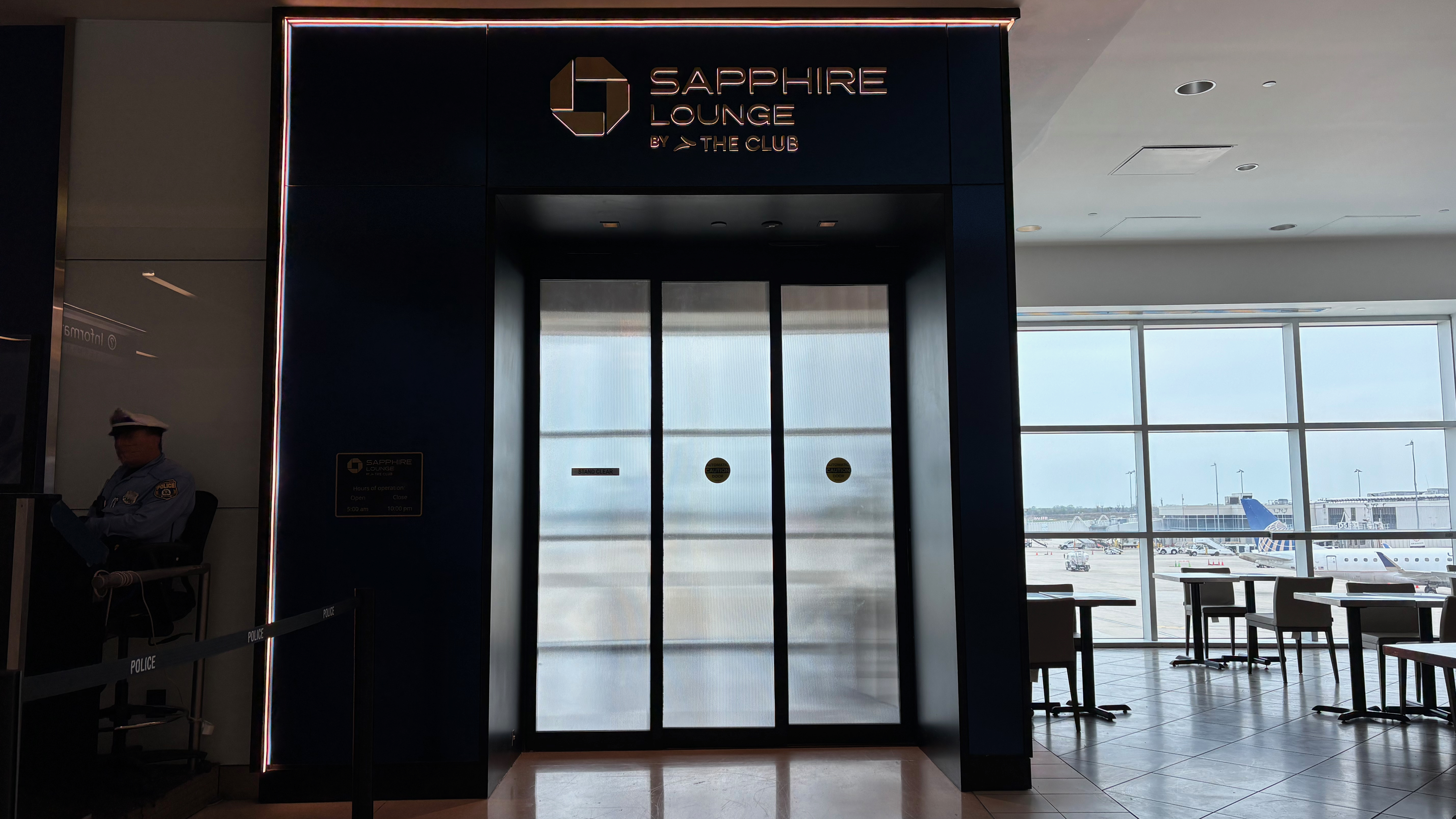 a large blue building with glass doors