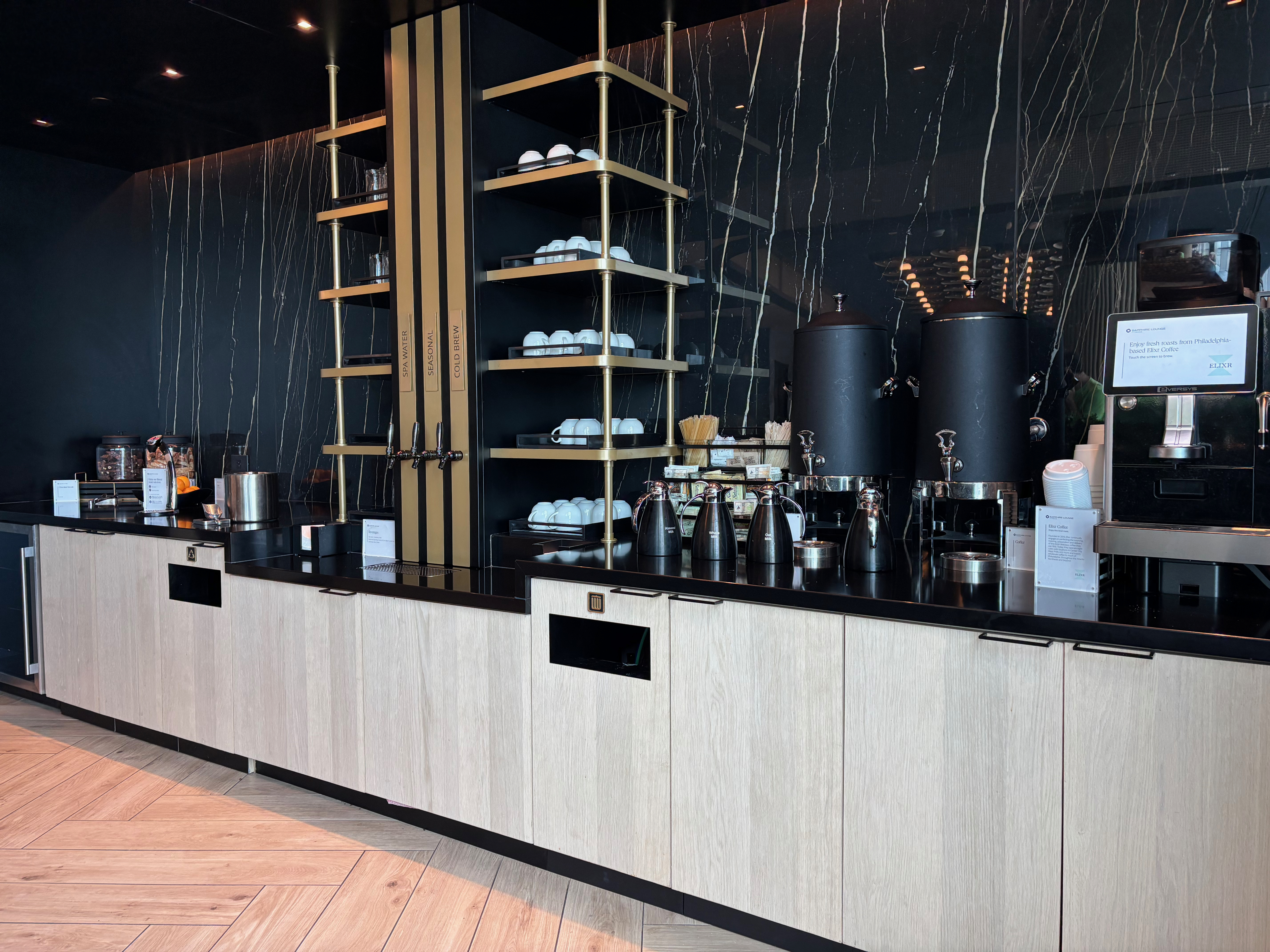 a counter with black and white cabinets