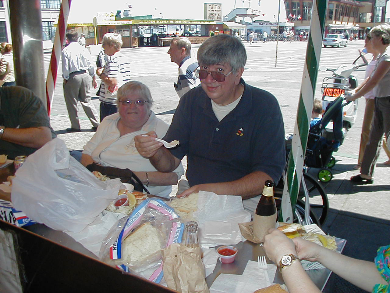 a man and woman sitting at a table