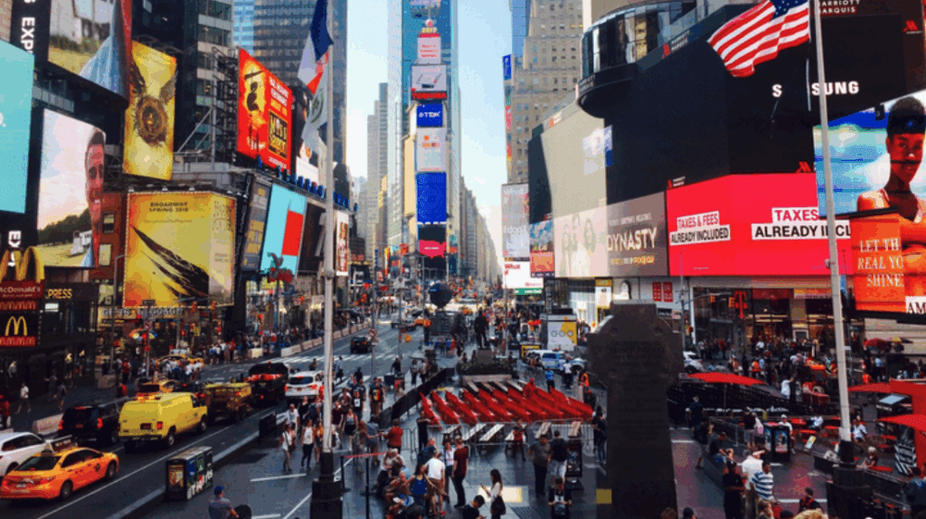 Times Square street with many tall buildings and people