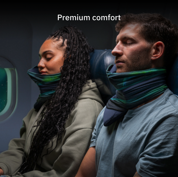 a man and woman sitting on a plane