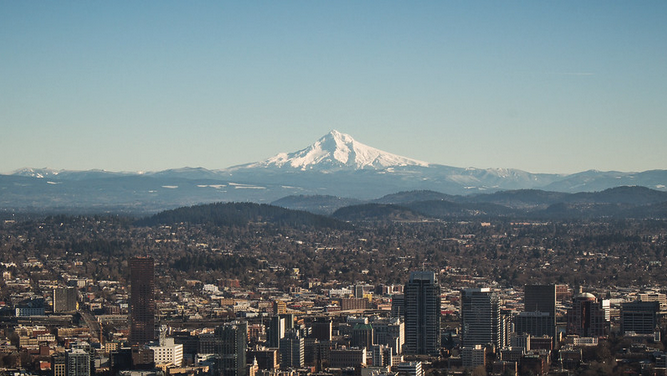 a city with a mountain in the background