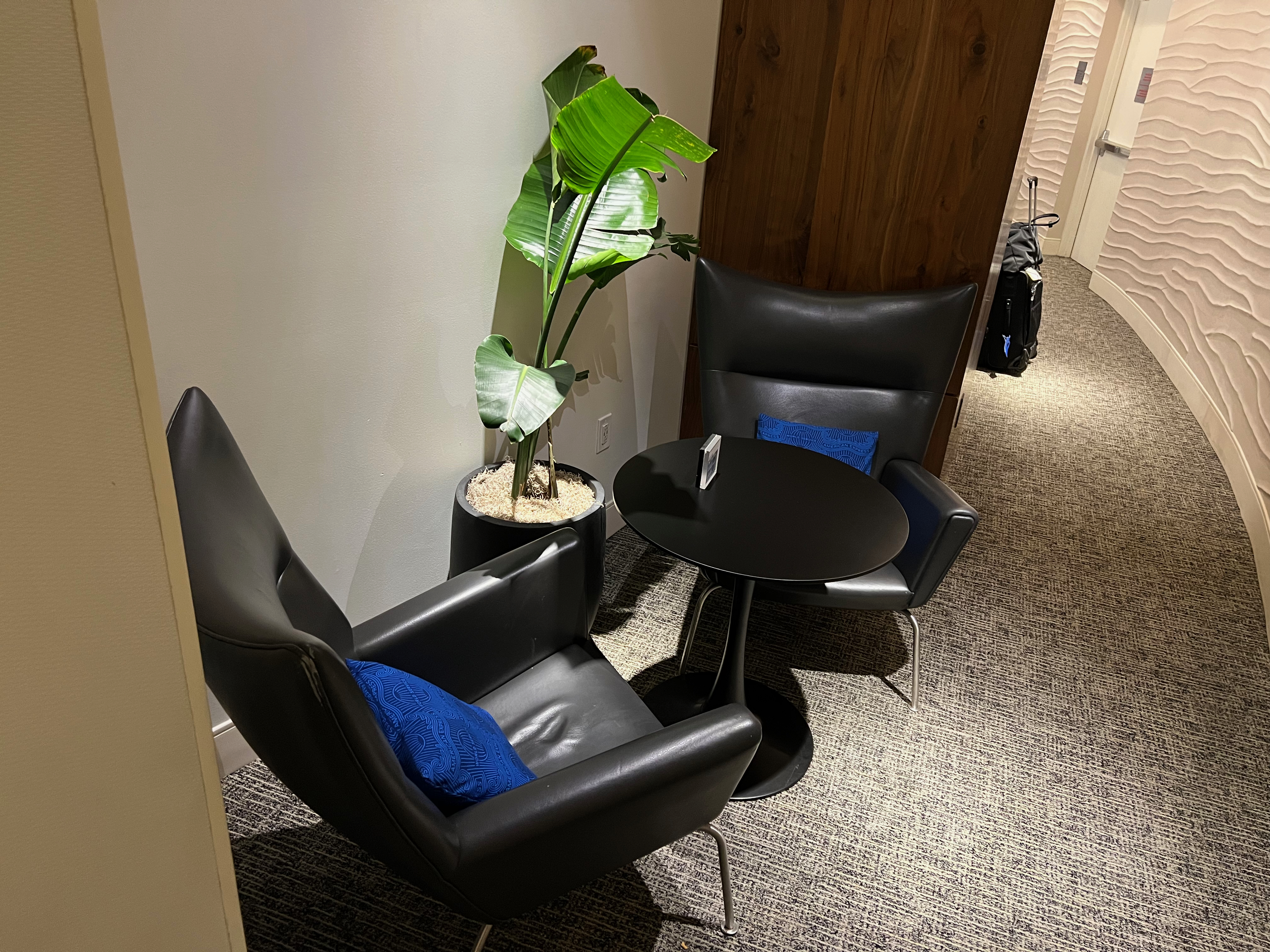 a black chairs and a table in a room