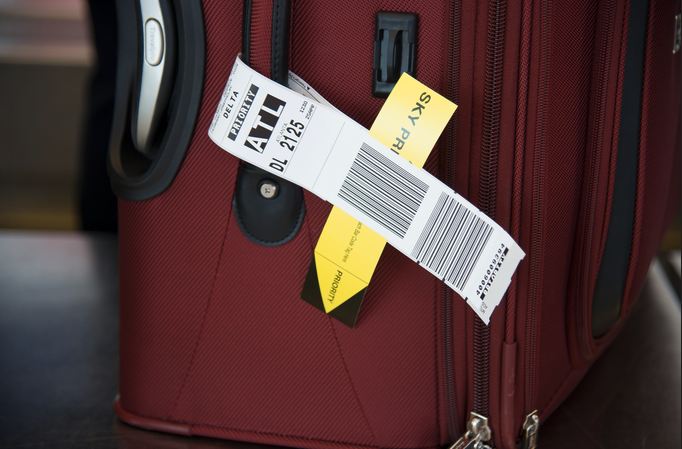 a luggage with a tag attached to it