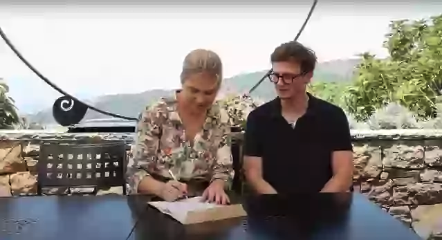 a man and woman sitting at a table