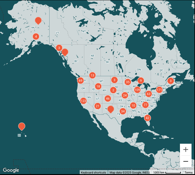 a map of the world with orange circles