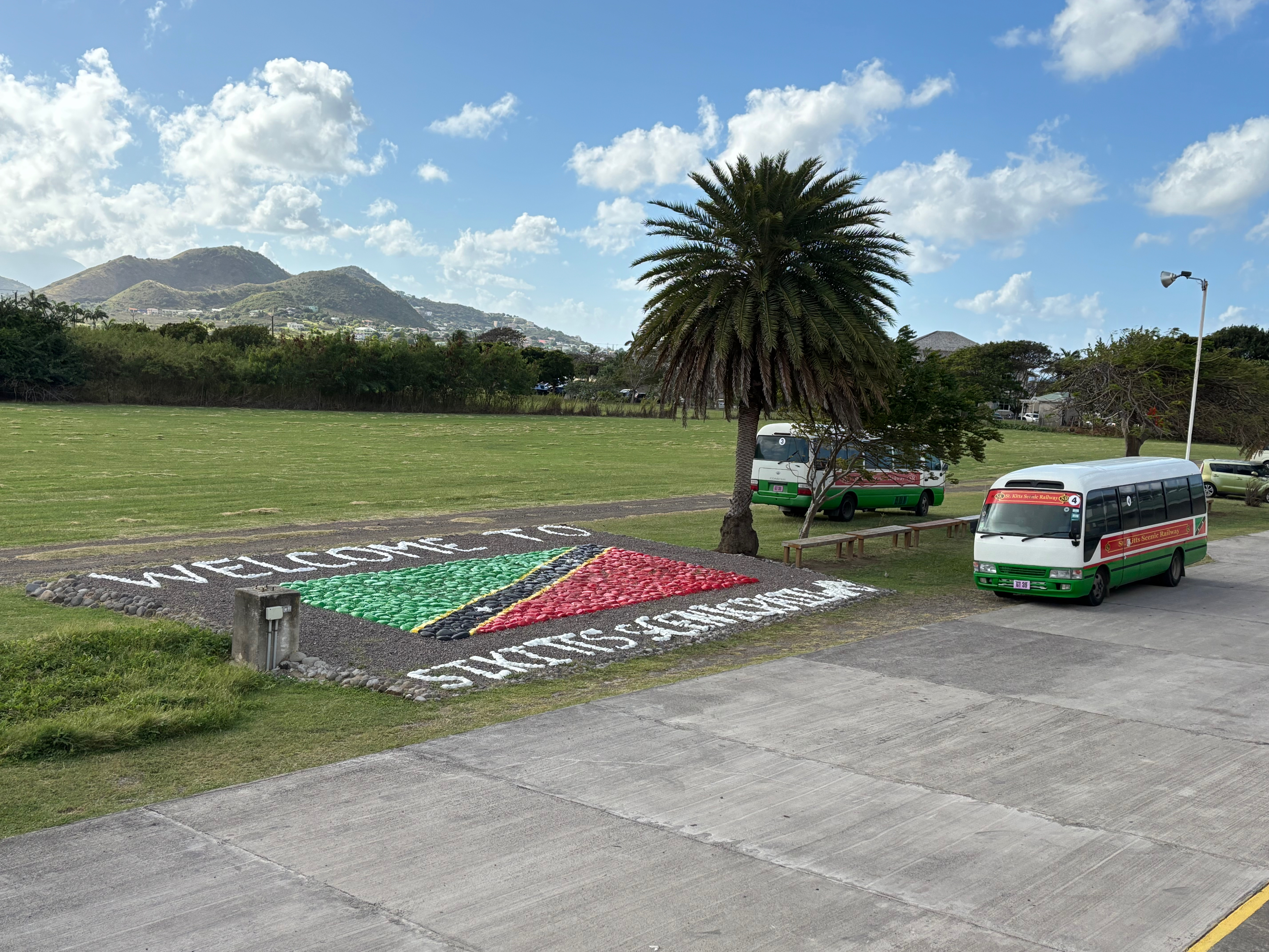 a group of buses parked in a field