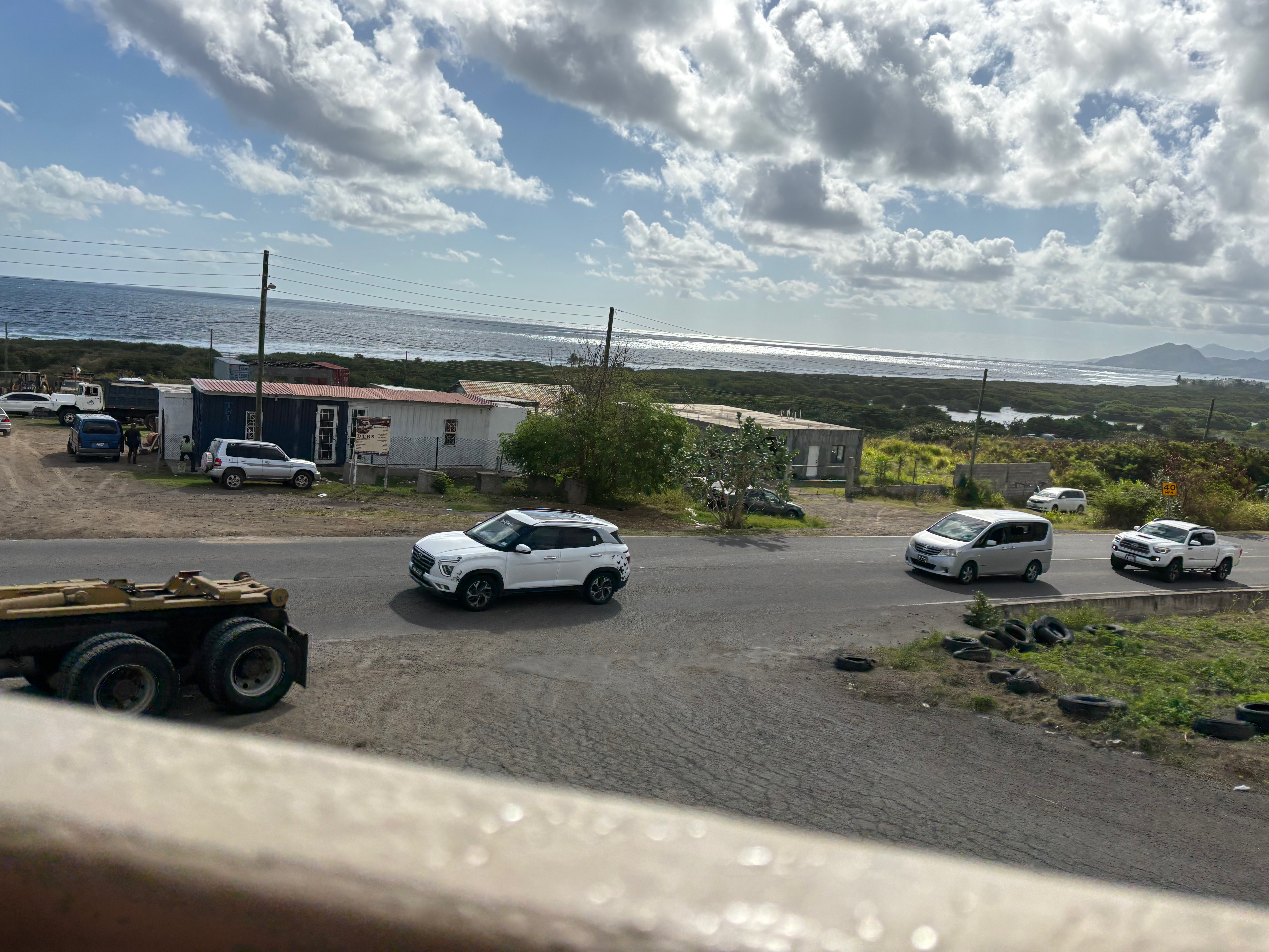 cars on the road by a building