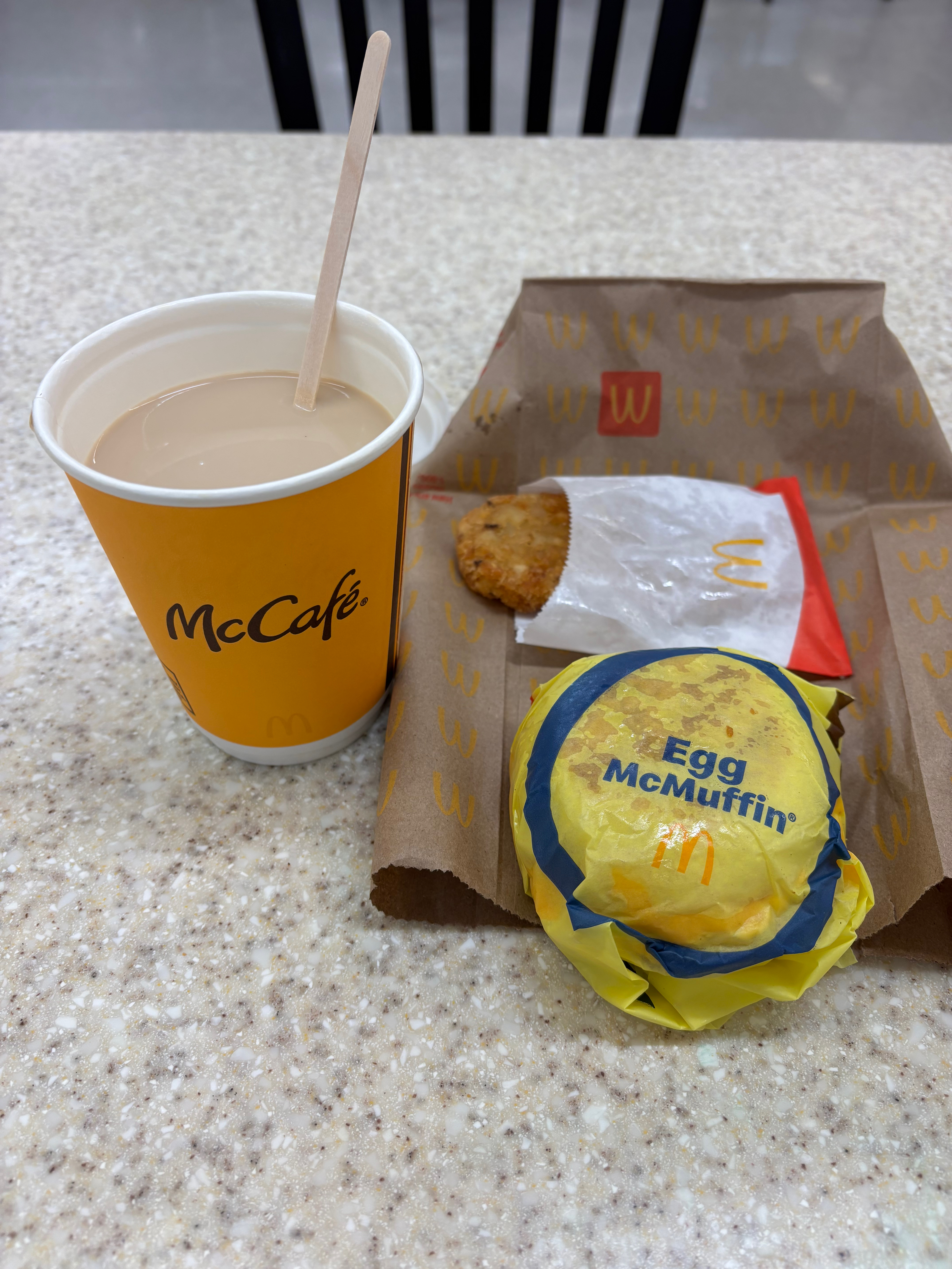 a fast food meal with a drink and a cup of coffee