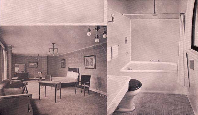 a bathroom with a bathtub and a bed