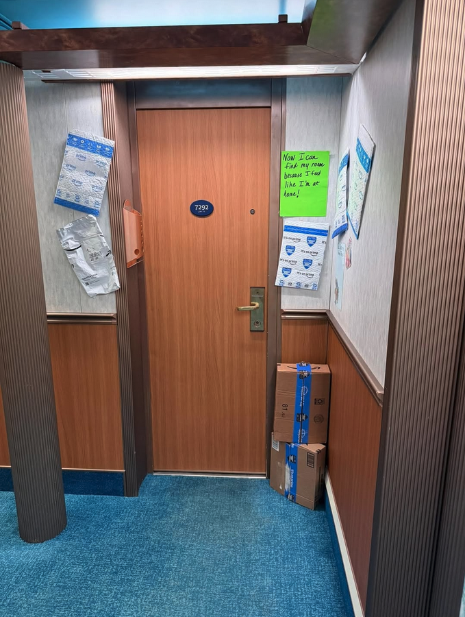 a door with papers on the wall