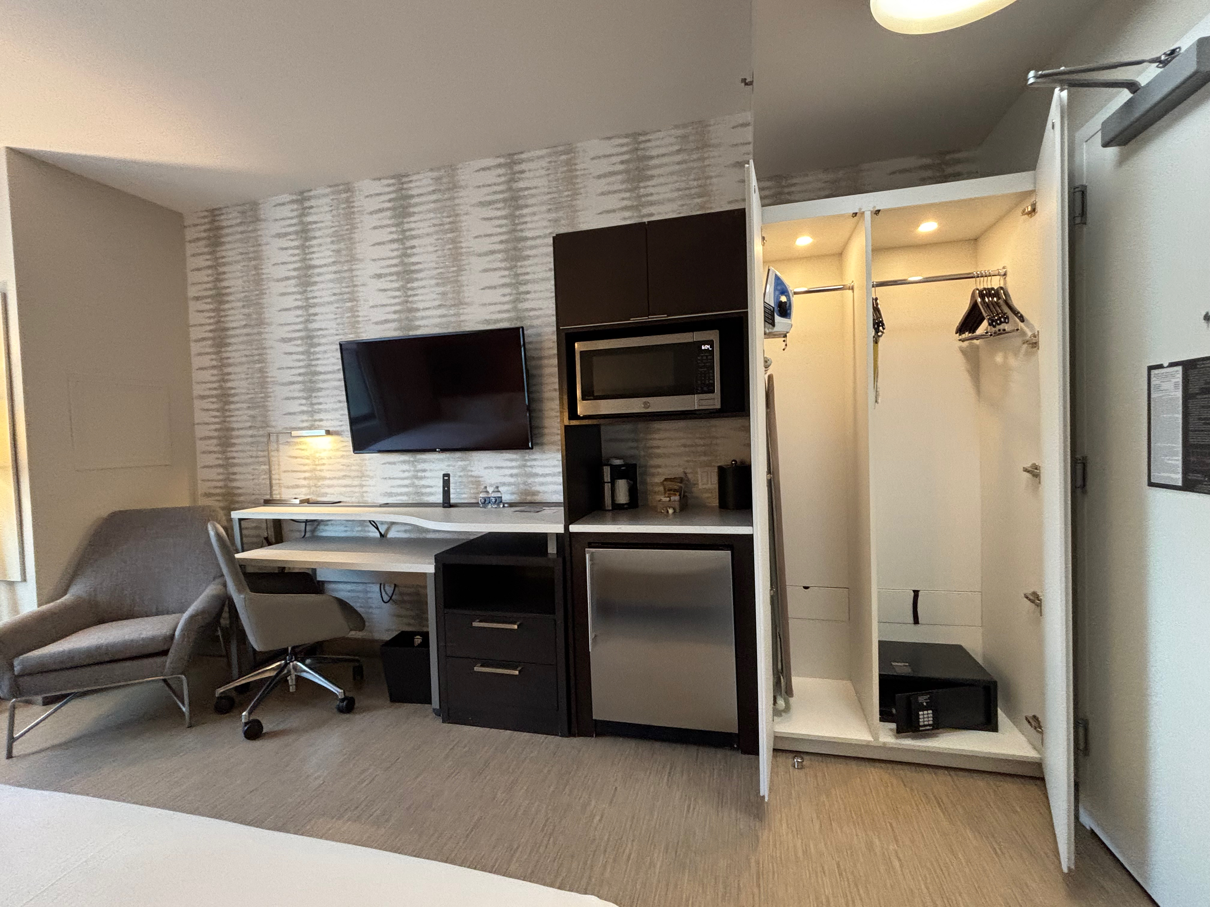 a room with a tv and a closet