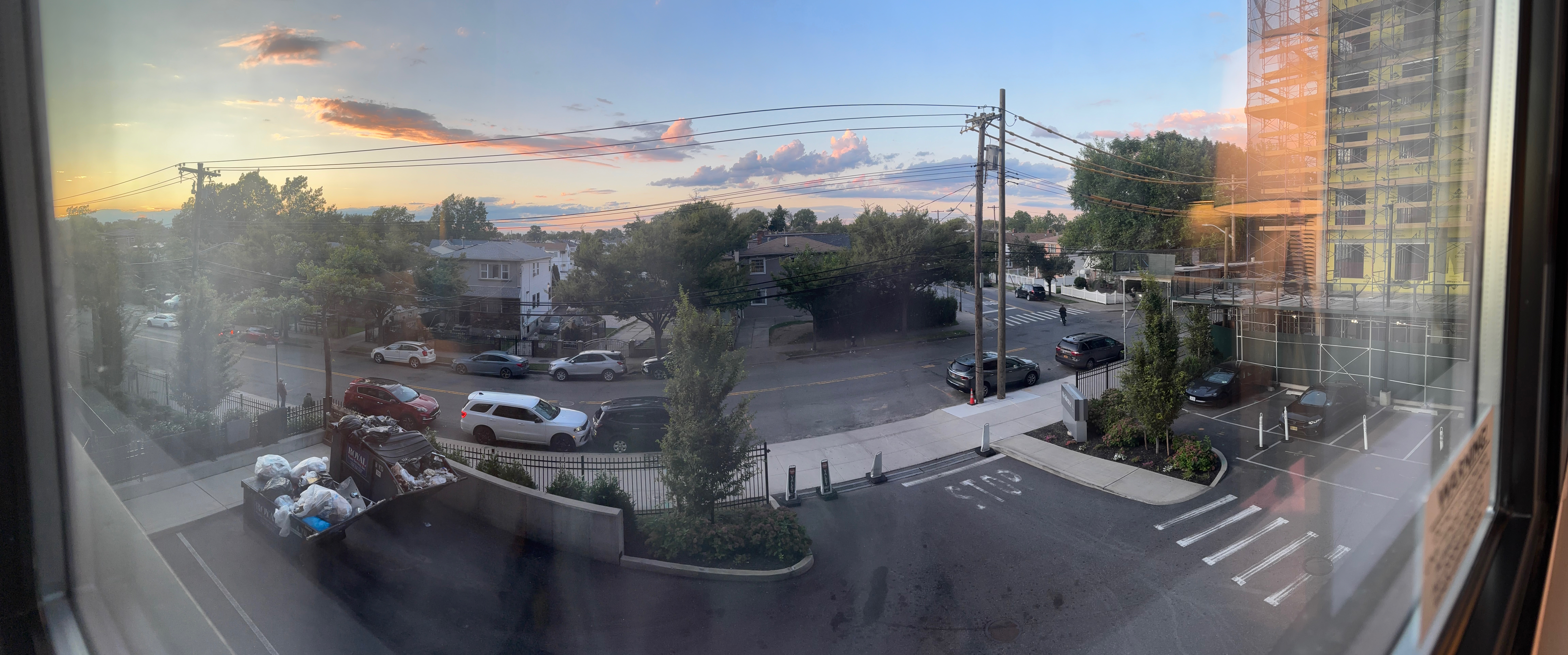 a view of a street and cars from a window