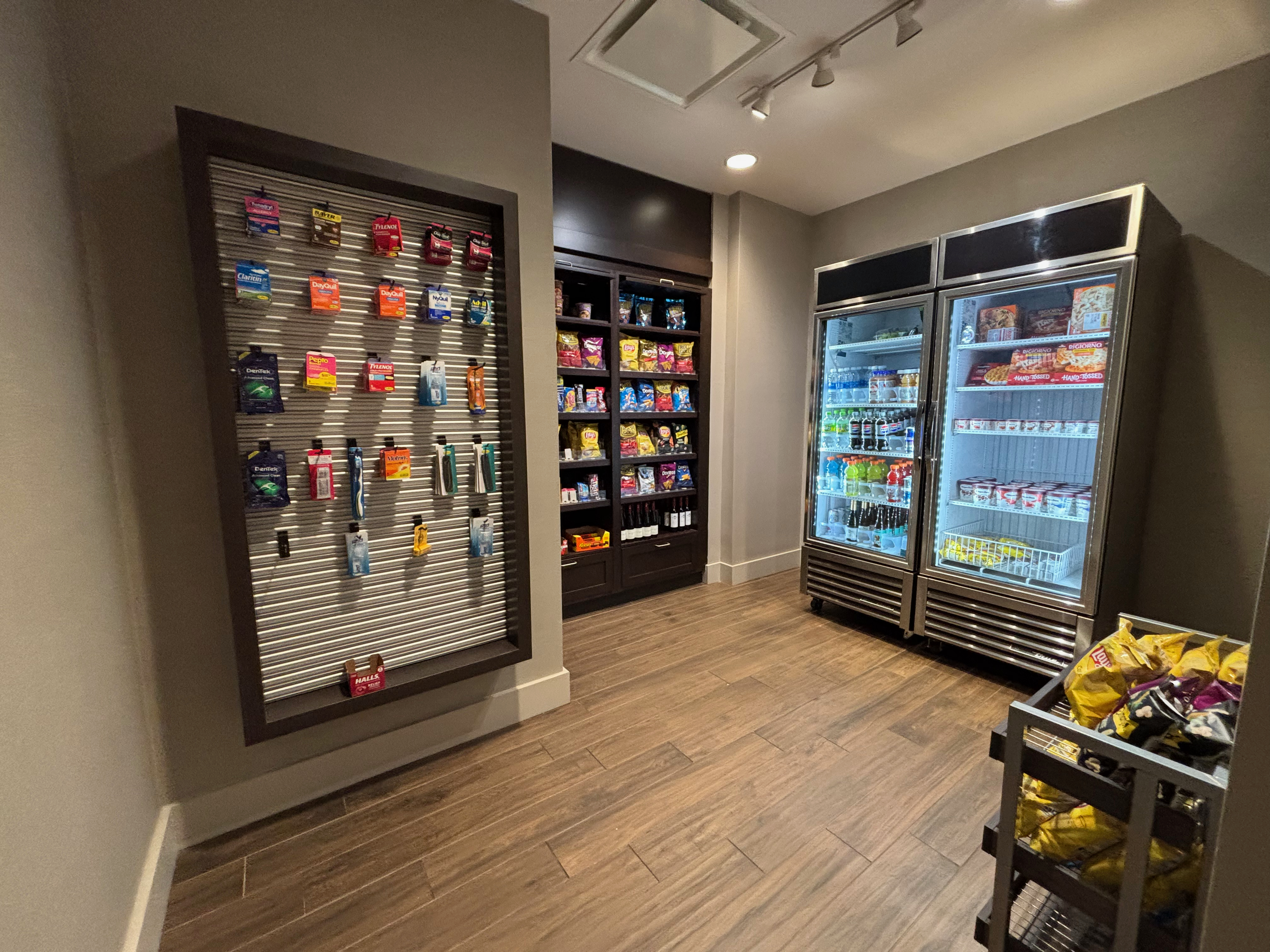 a store with shelves of snacks and ice cream