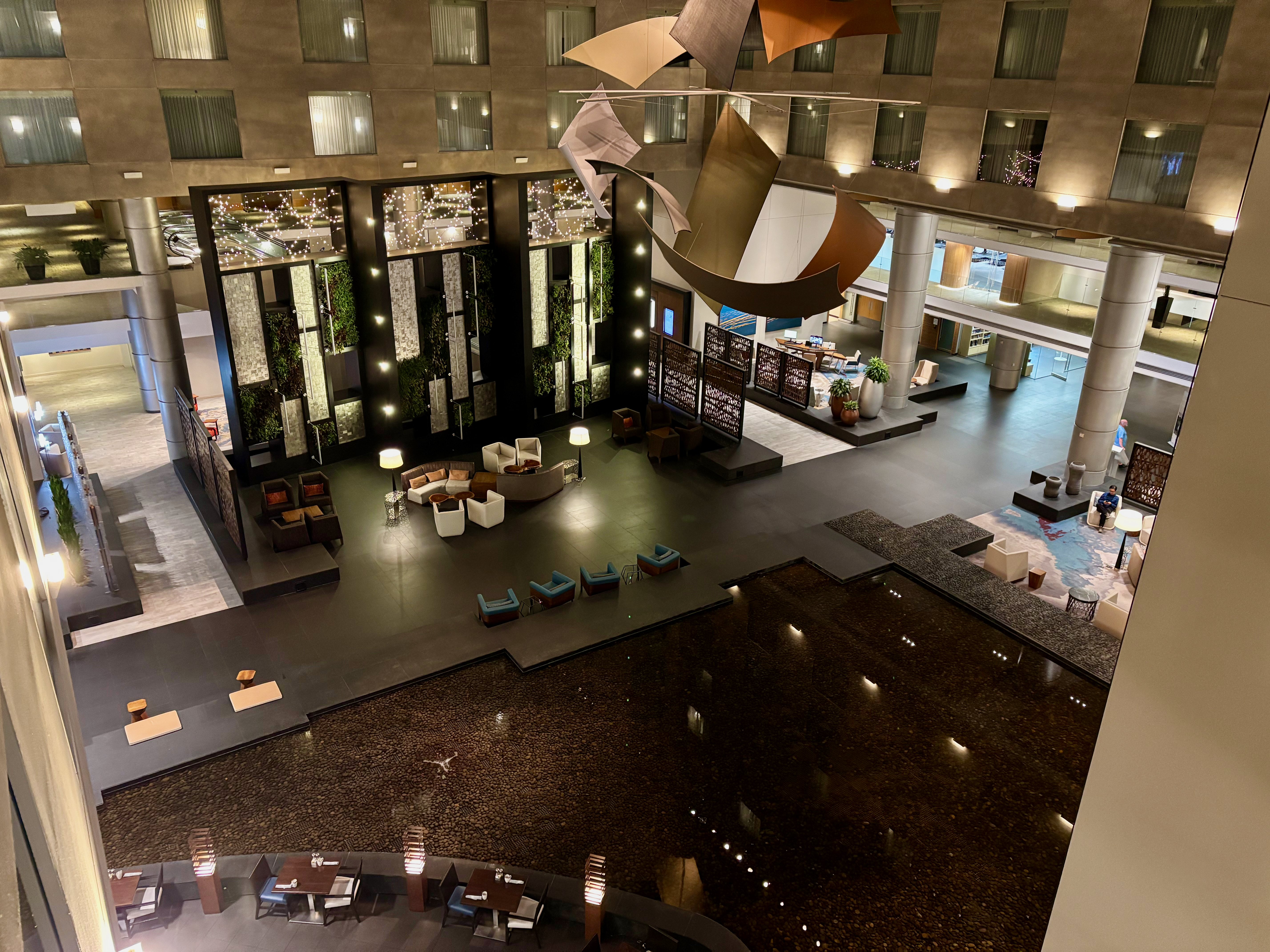 a large lobby with a large pool and a large building