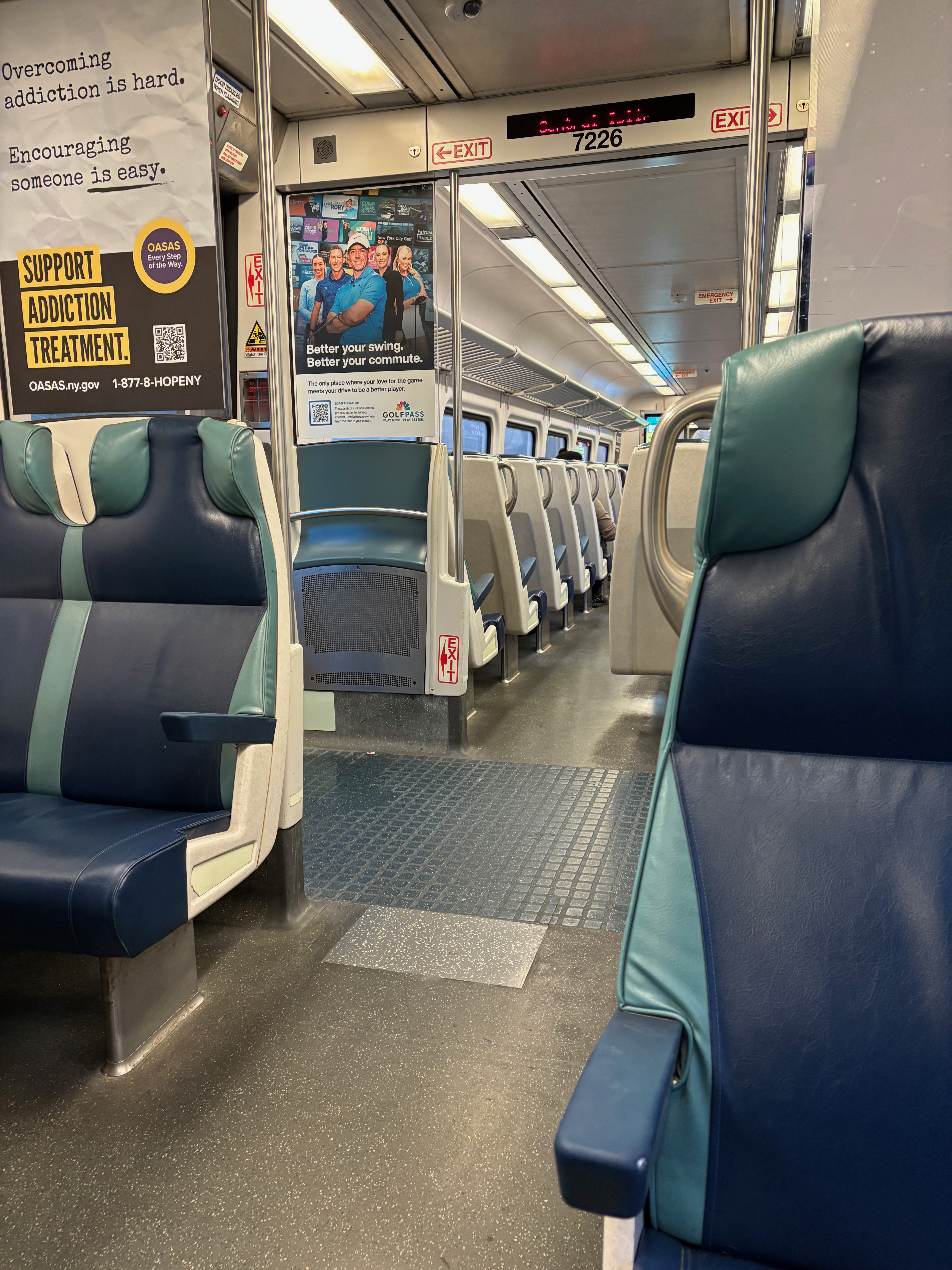 a train with seats and a sign