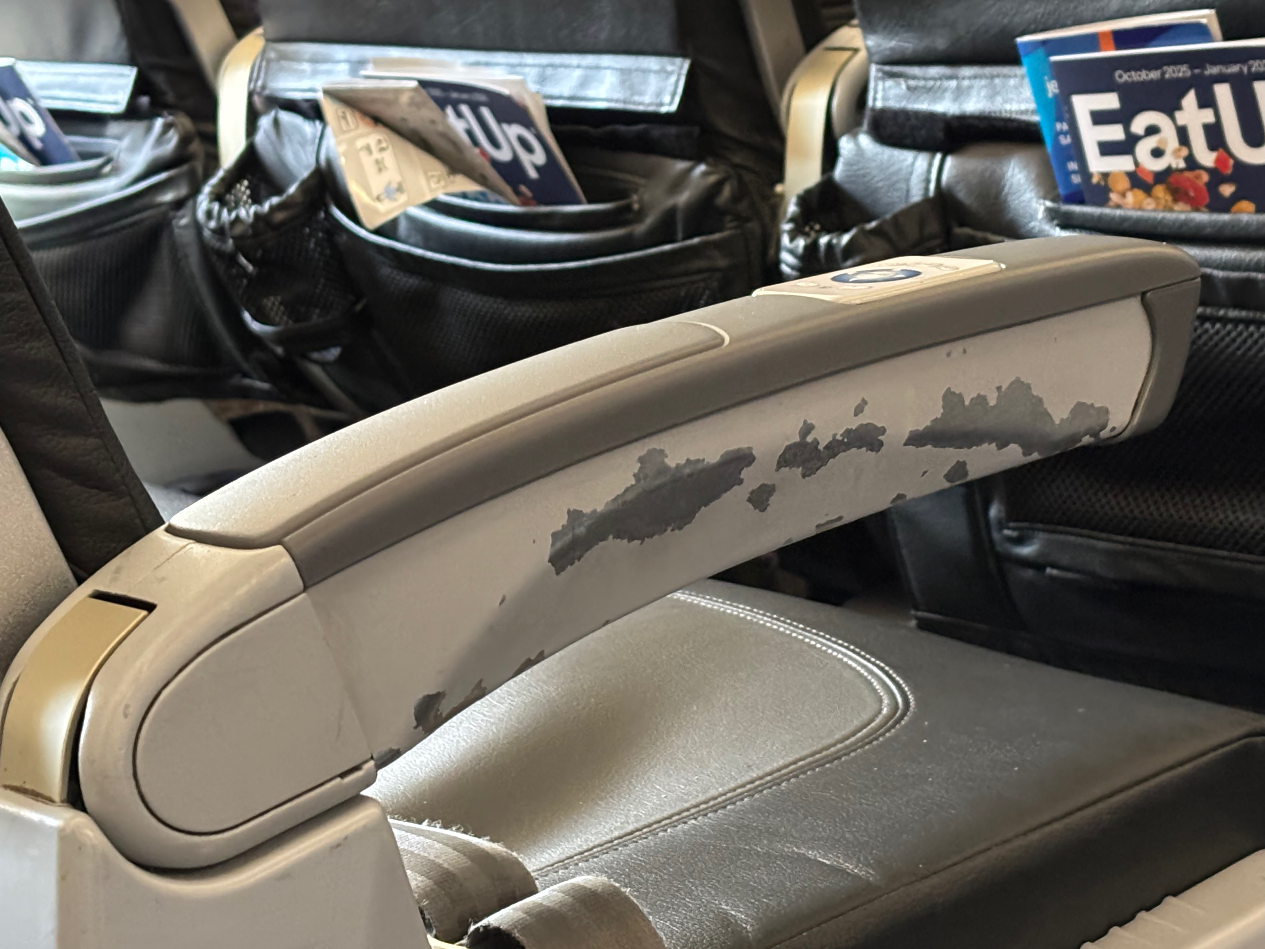 a close up of a seat arm rest