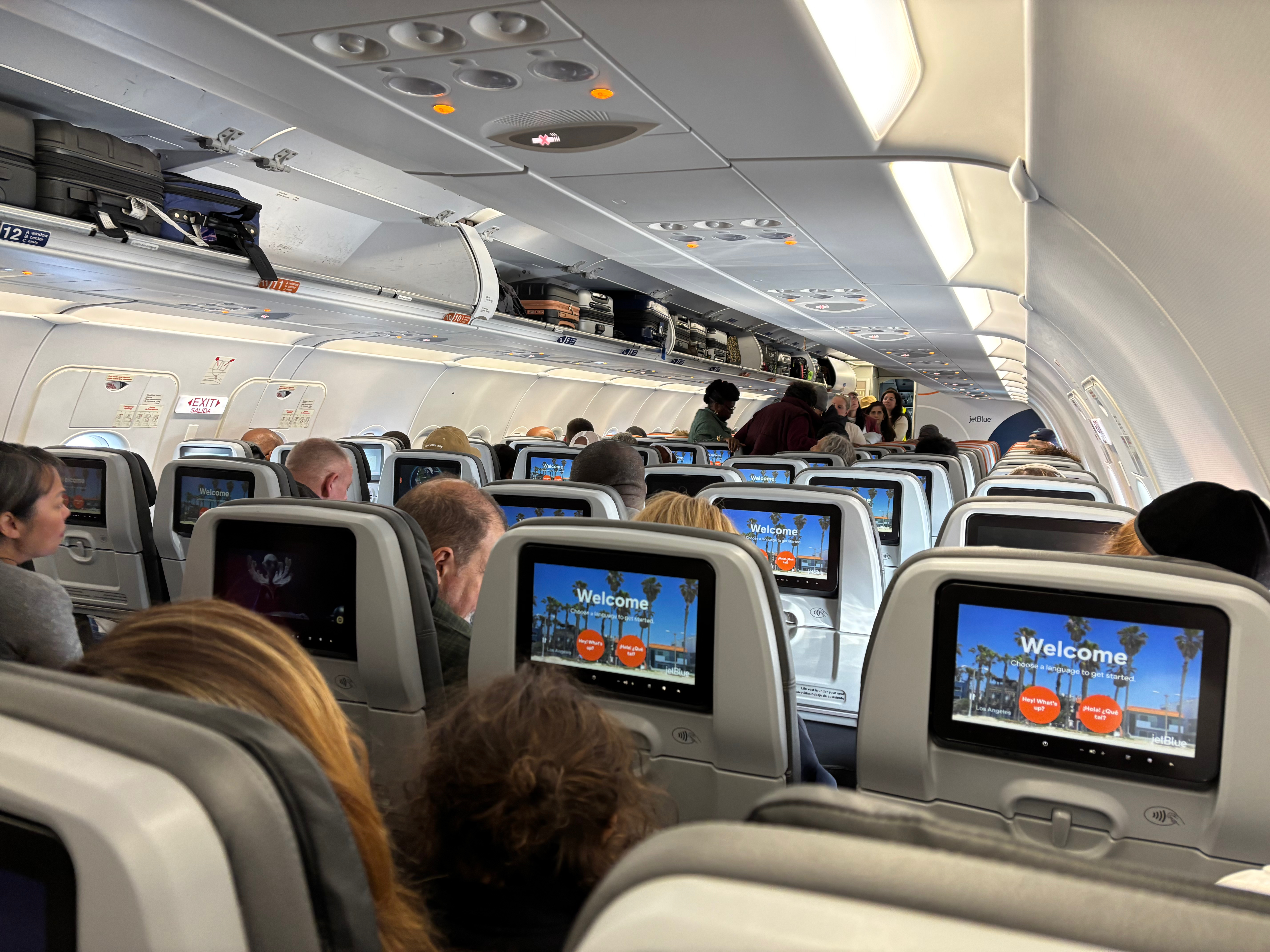 a group of people sitting in an airplane