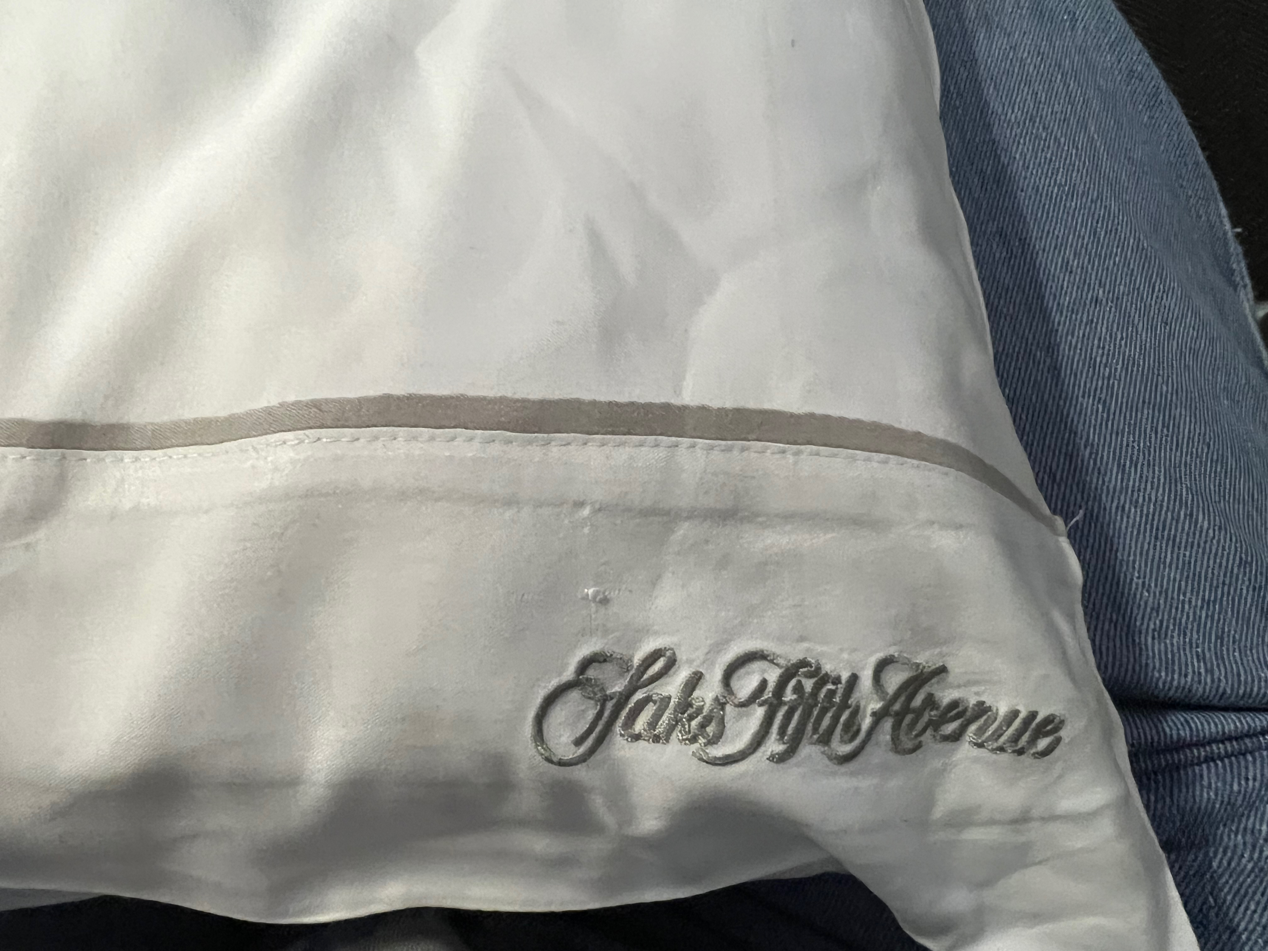 a white pillow with a logo on it