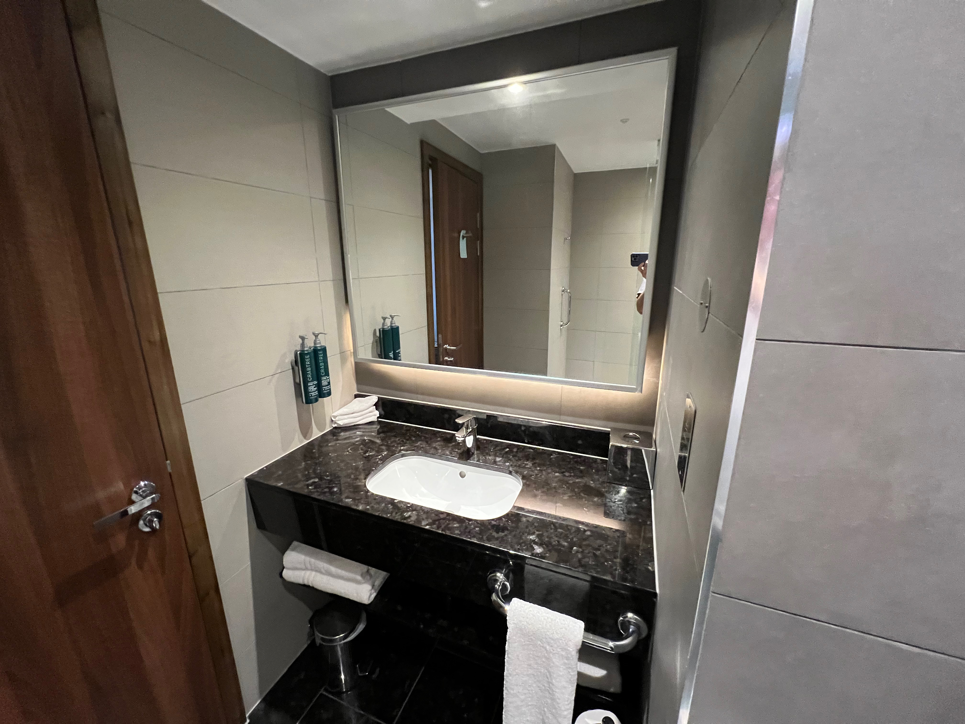 a bathroom with a mirror and sink