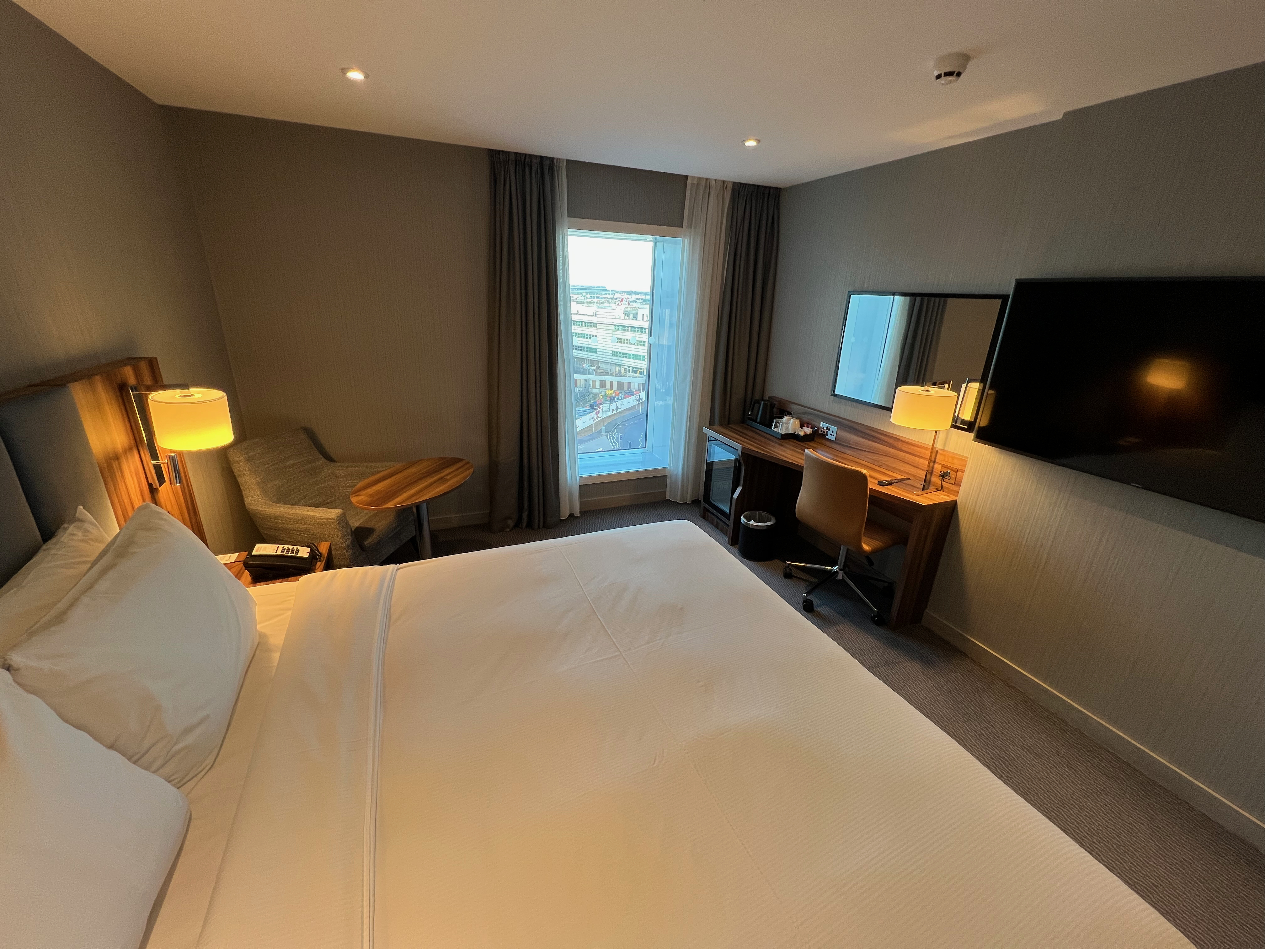 a room with a bed and a tv