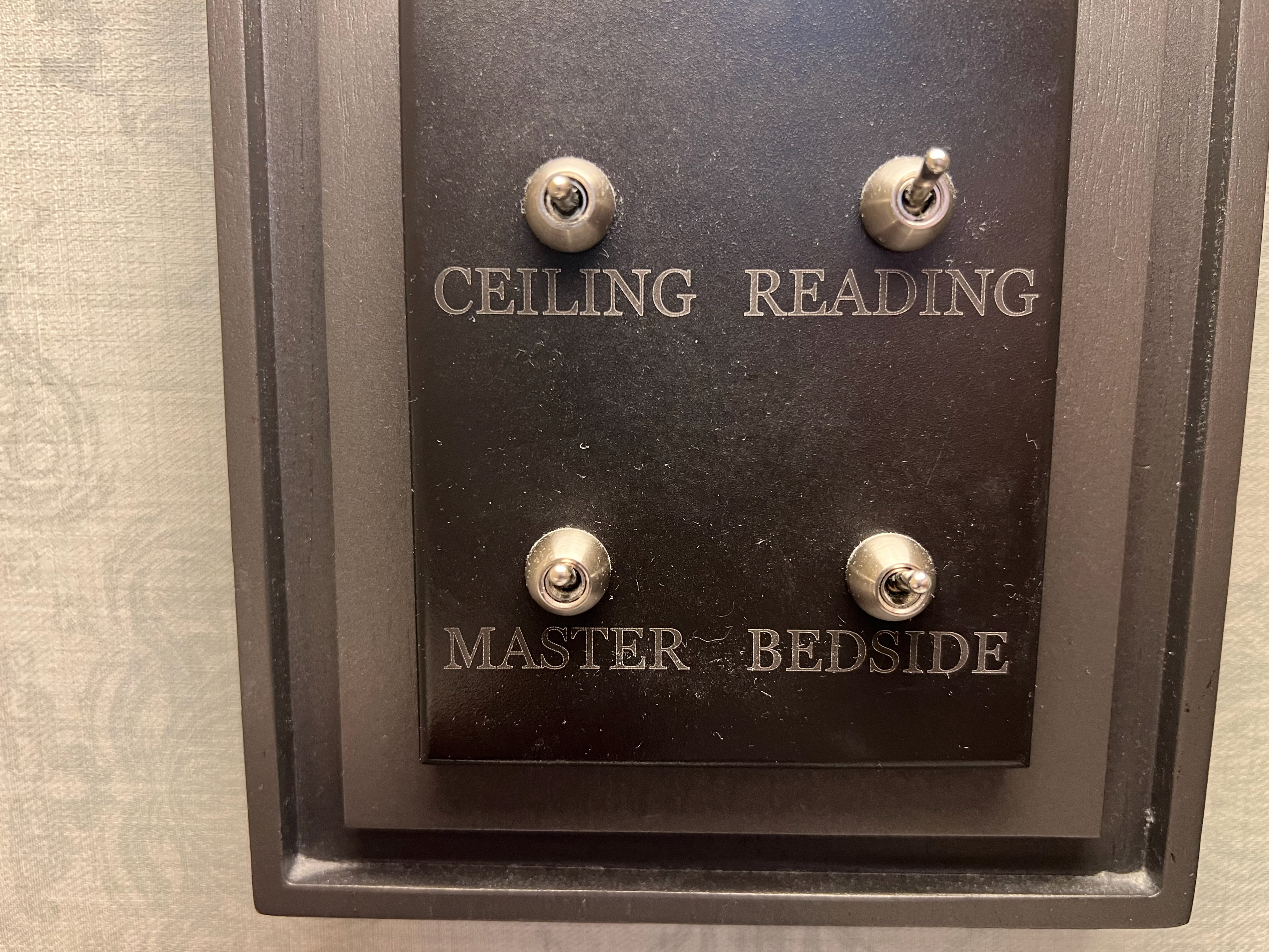 a black rectangular box with silver buttons