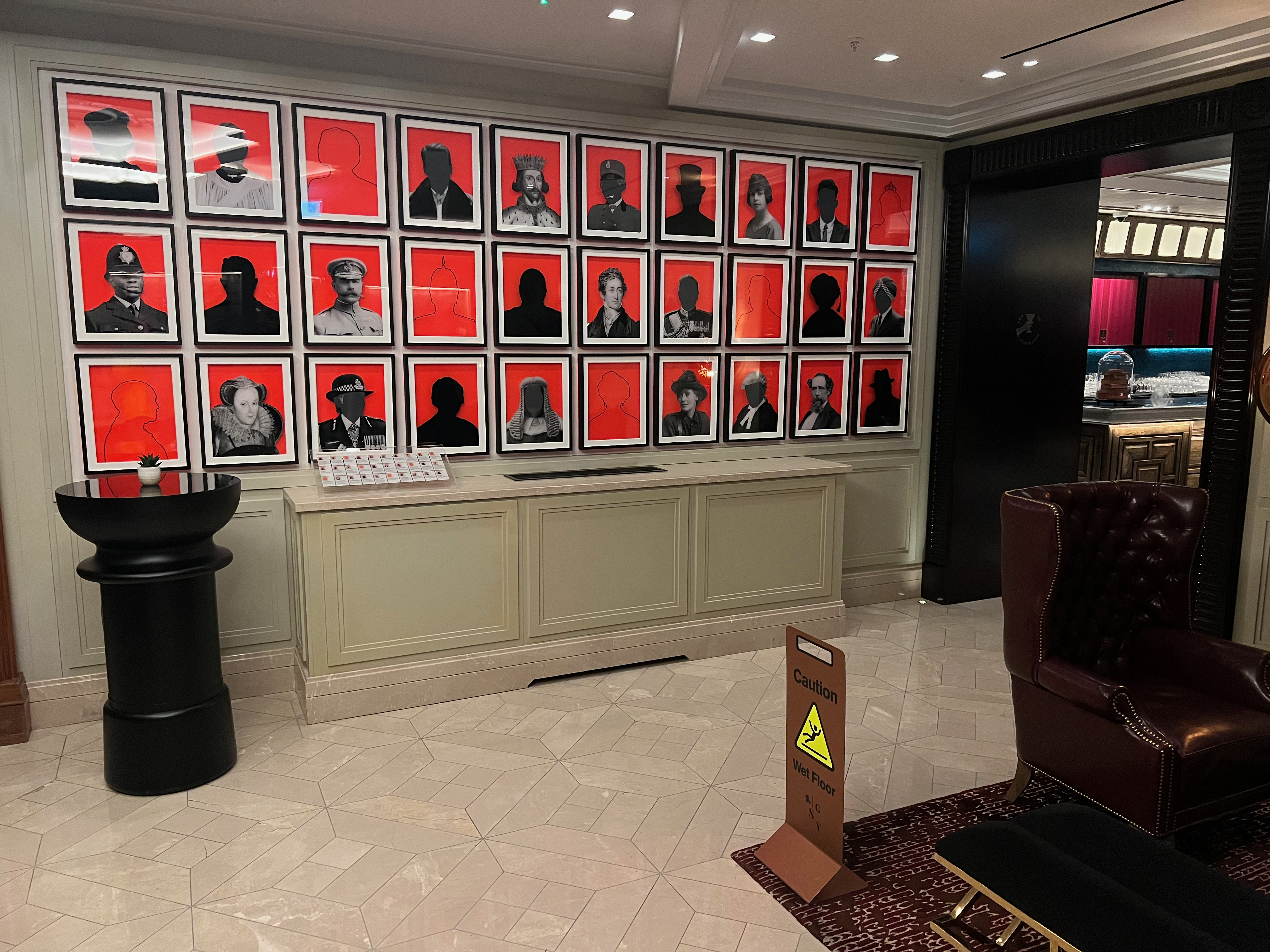 a wall of pictures on the wall