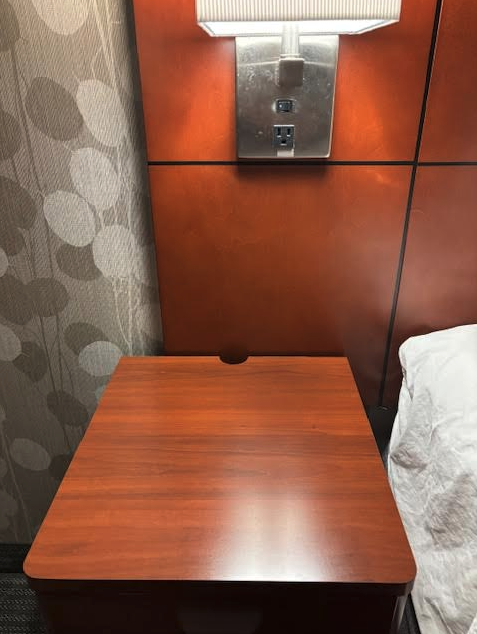 a table next to a wall