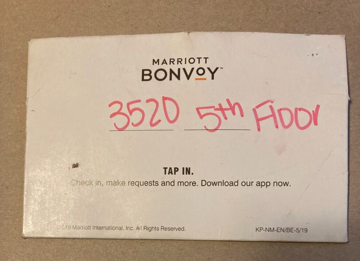 a white box with red writing on it