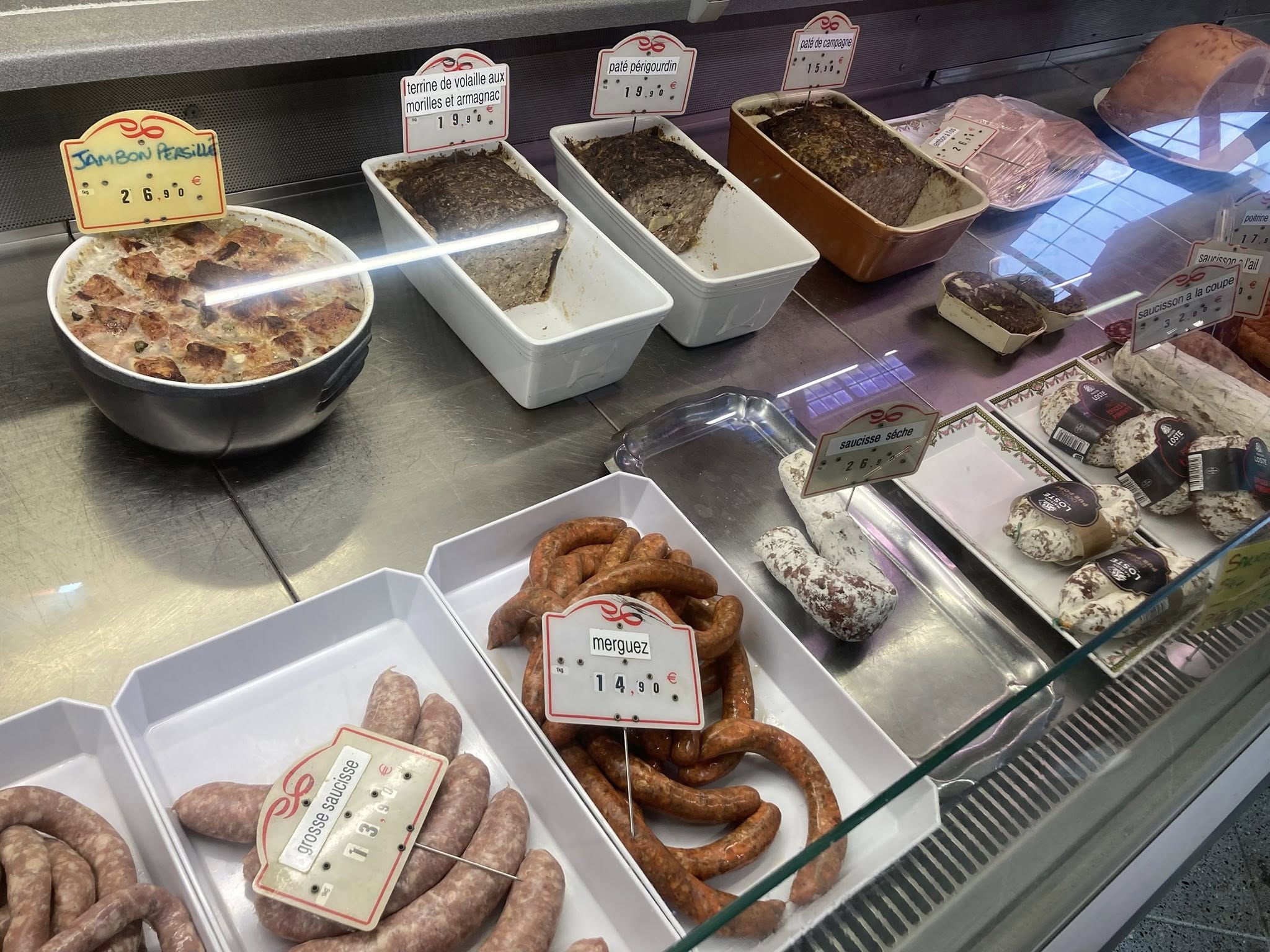 a display case with different types of meats