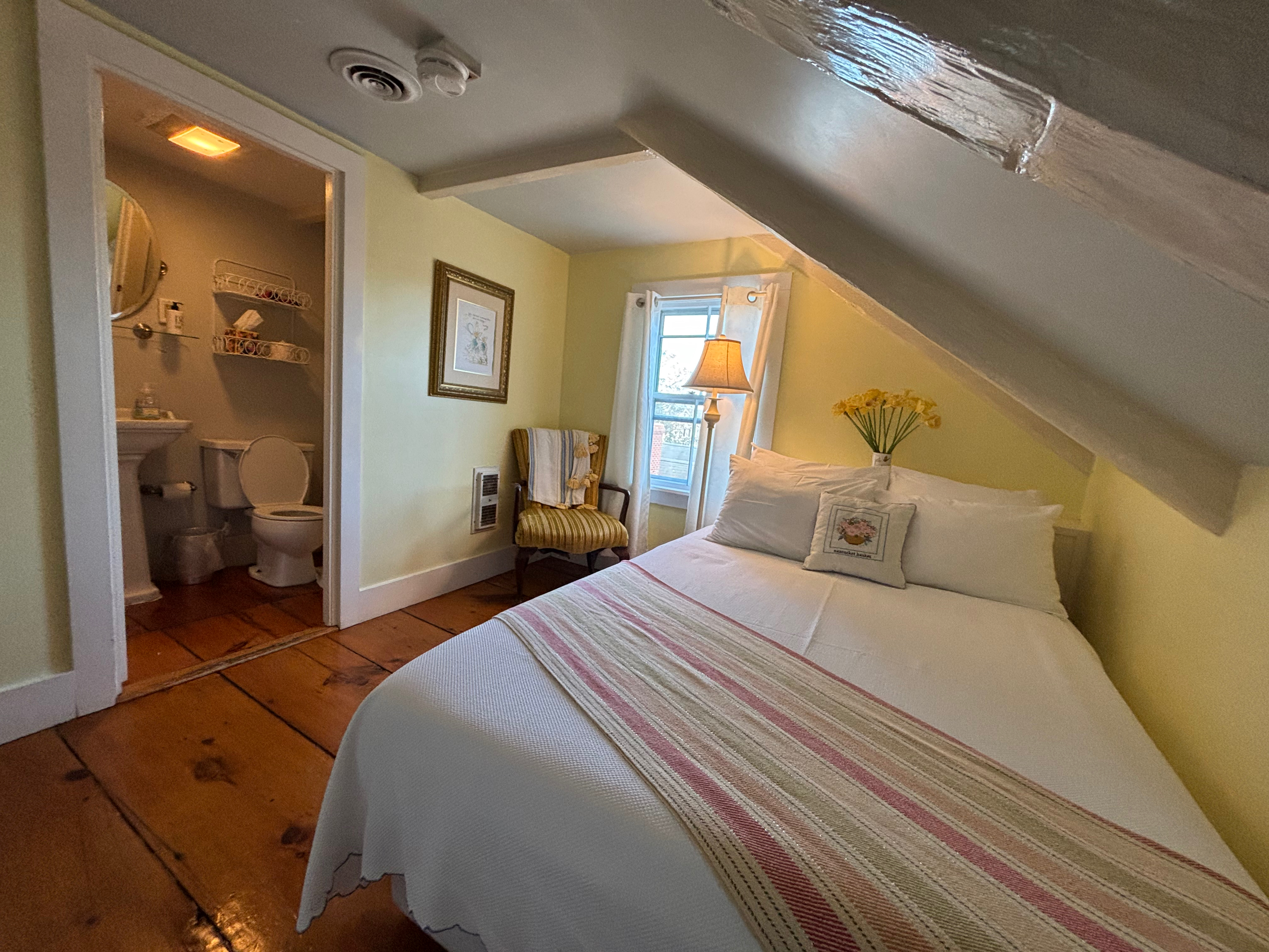 a bedroom with a bed and a toilet