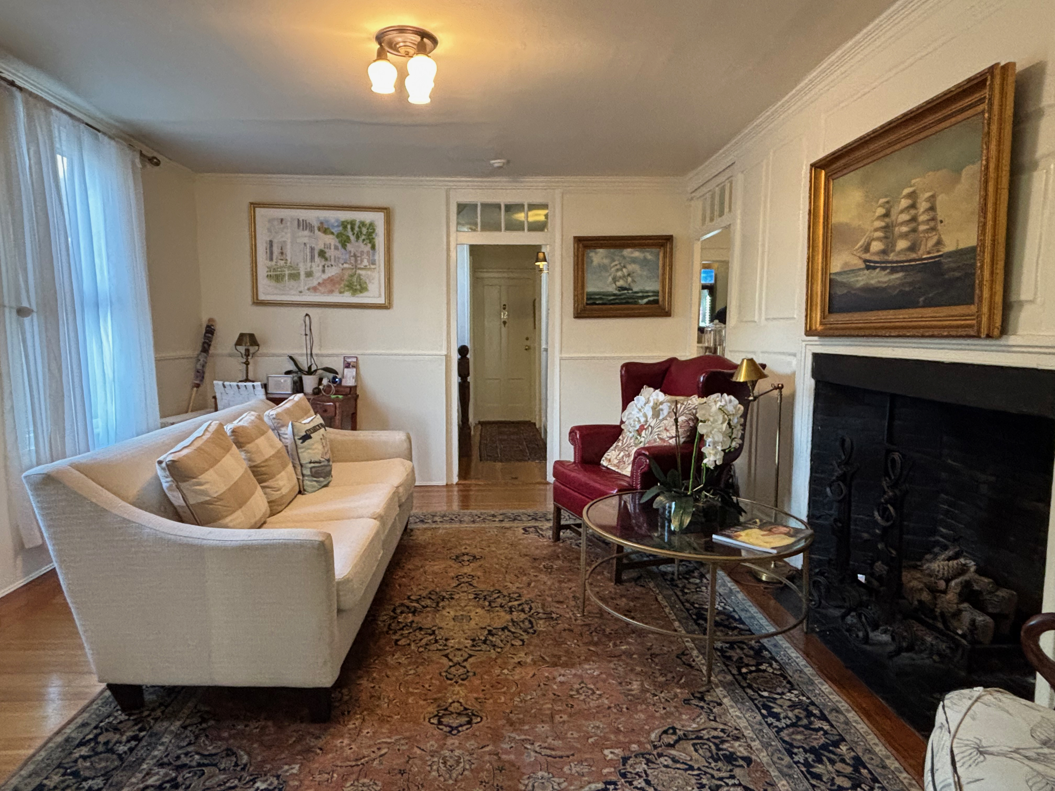 a living room with a fireplace and couch