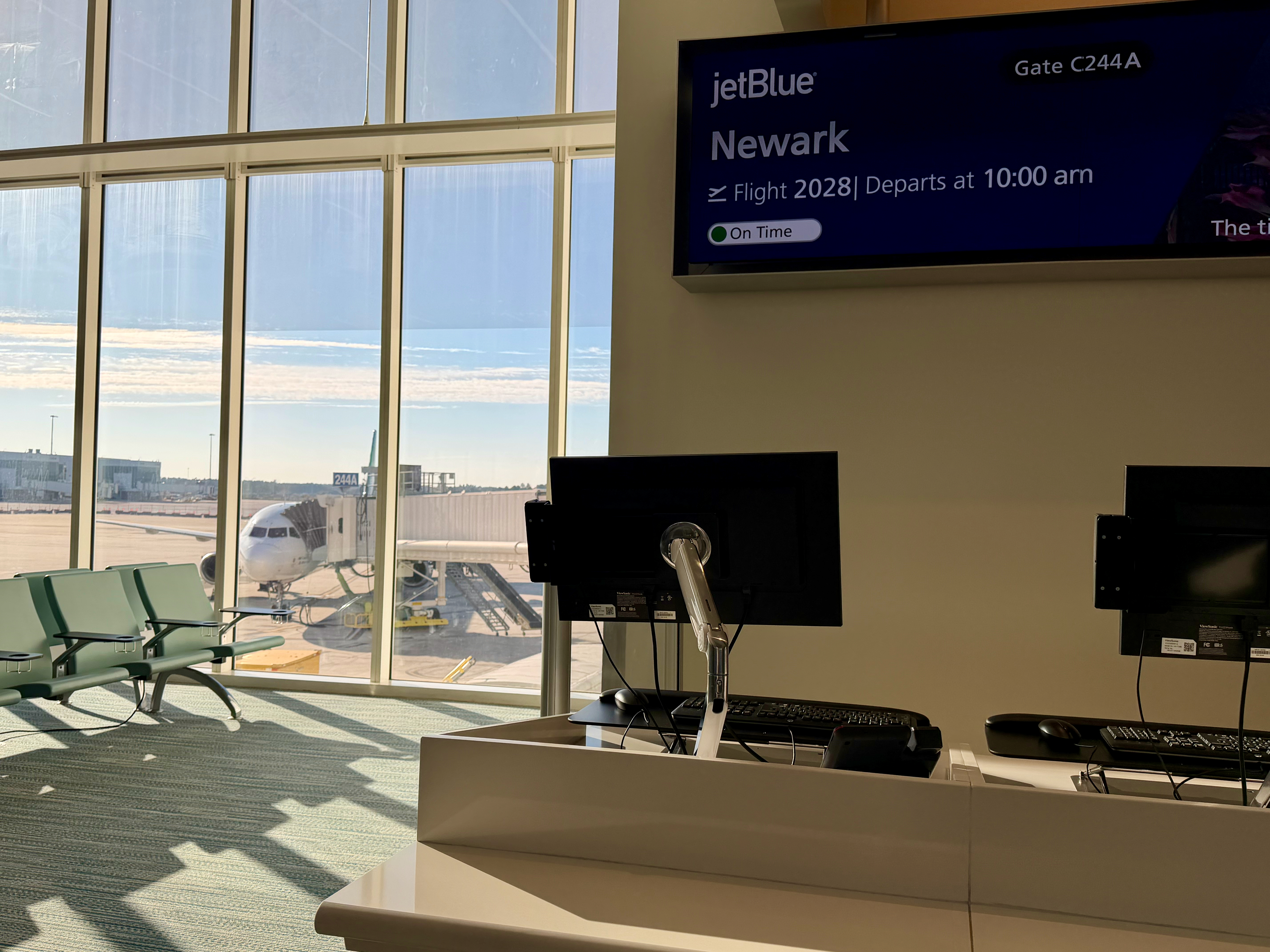 a computer in a room with a large window