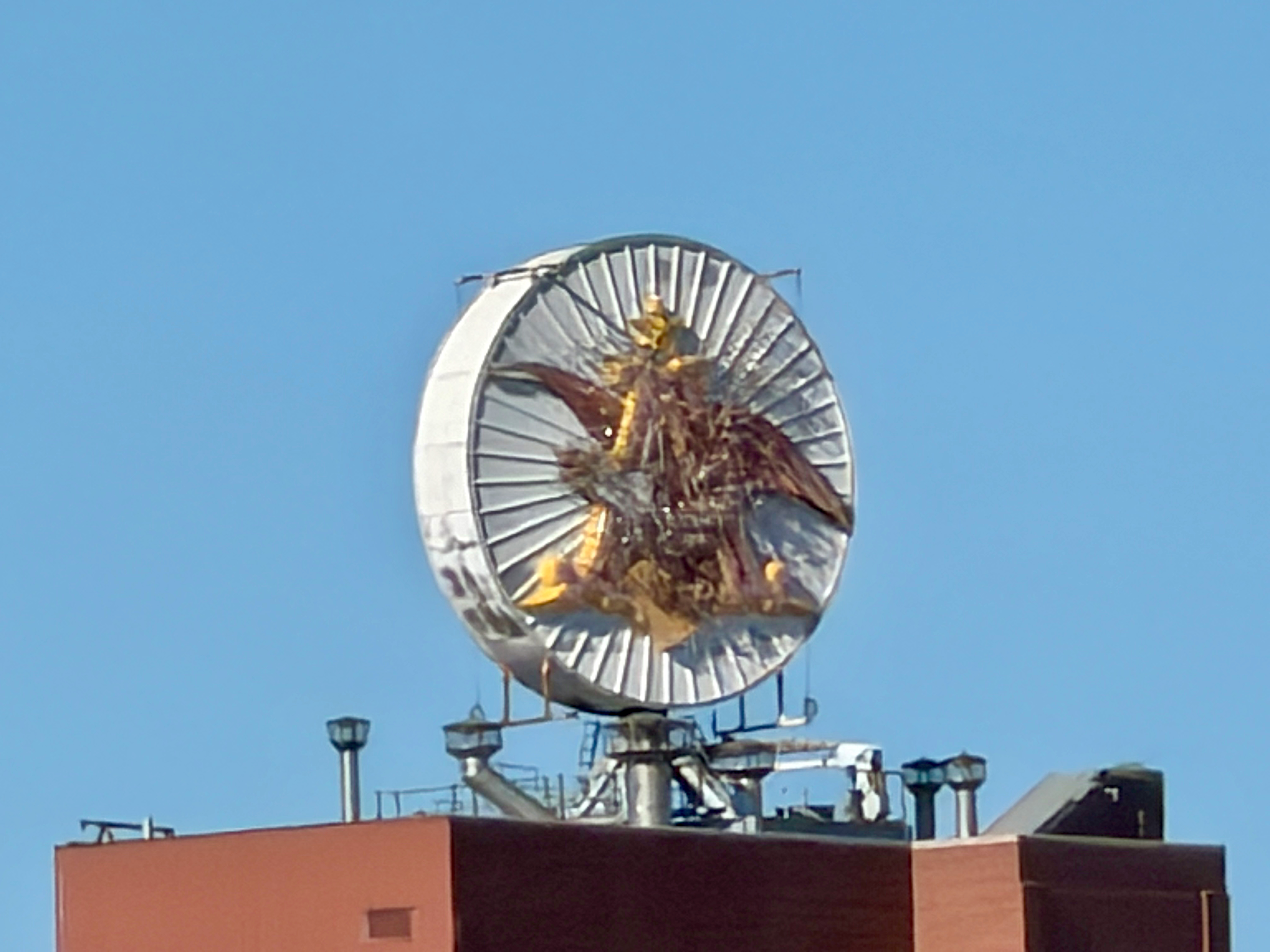 a satellite dish on top of a building