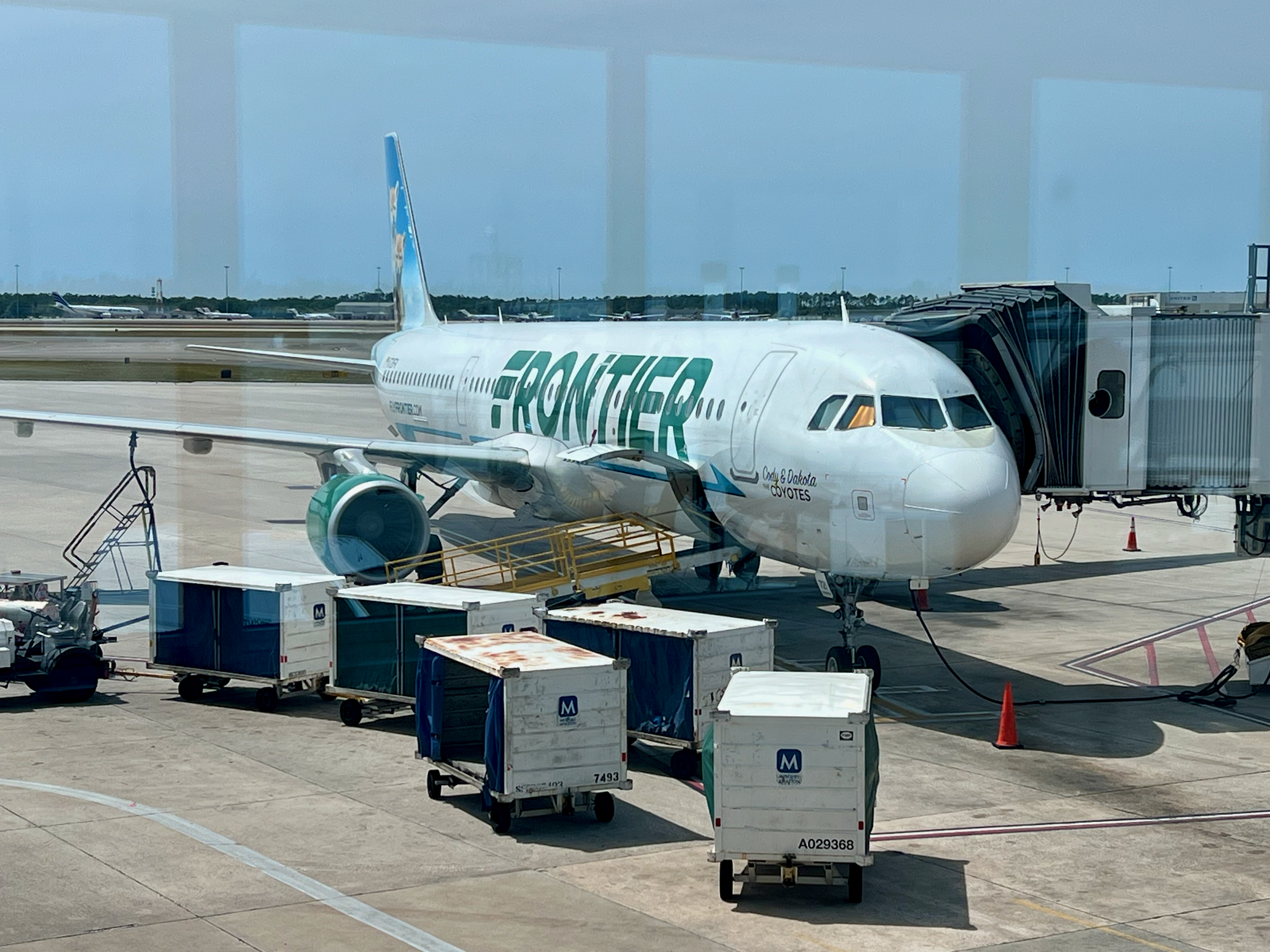 a white airplane on a runway