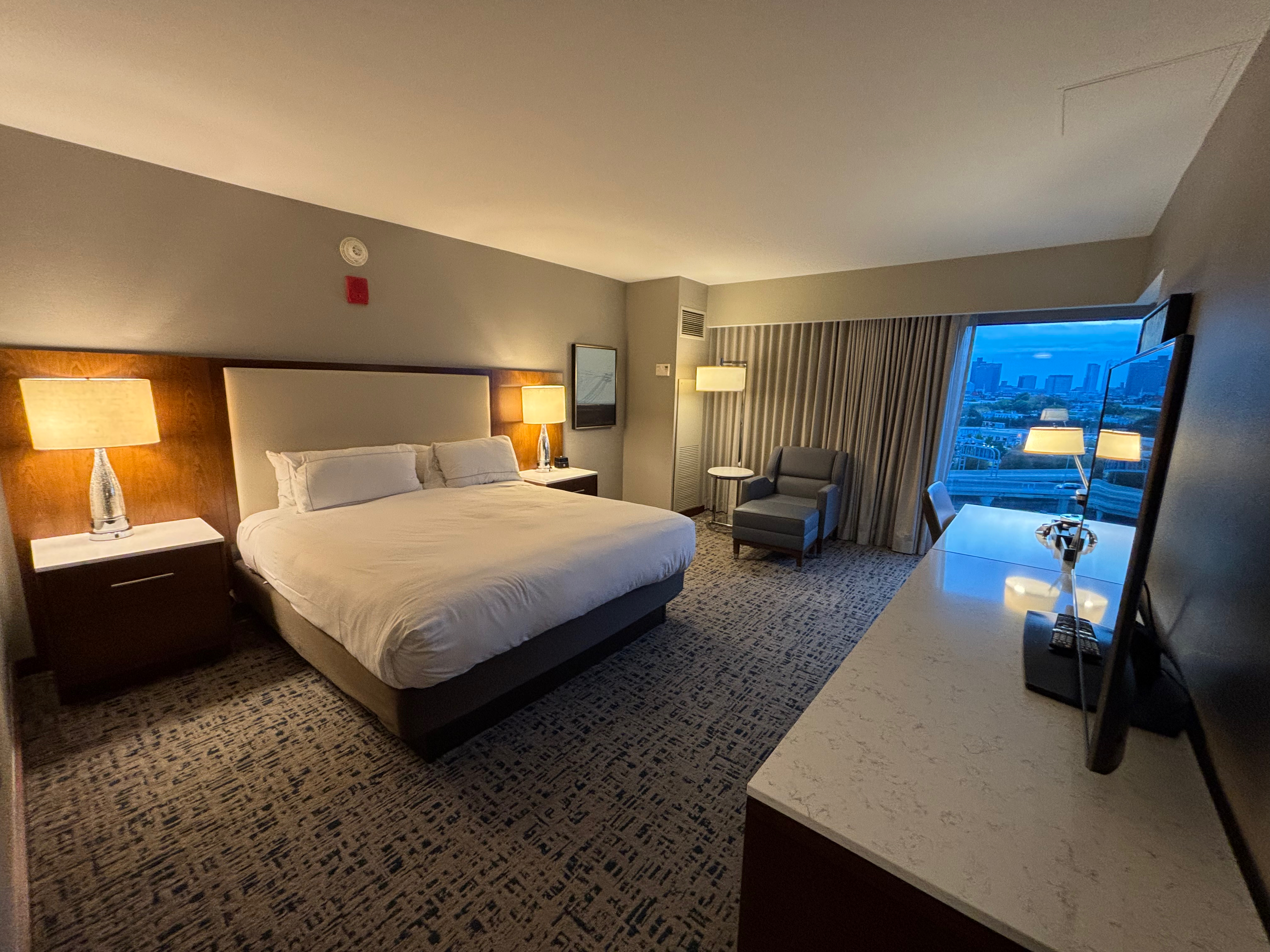 a room with a bed and a desk