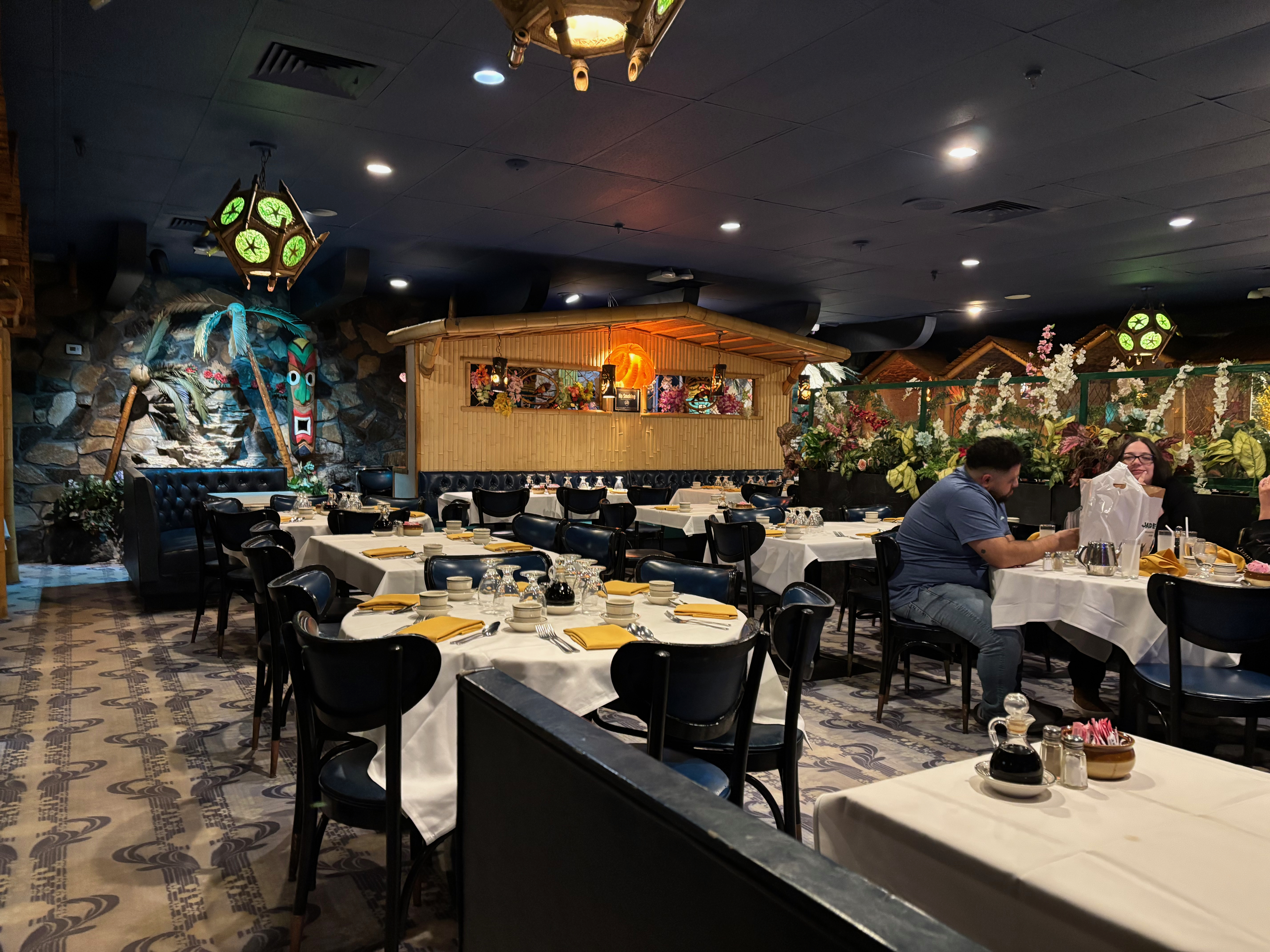 The dining room at Jade Island with tables and booths