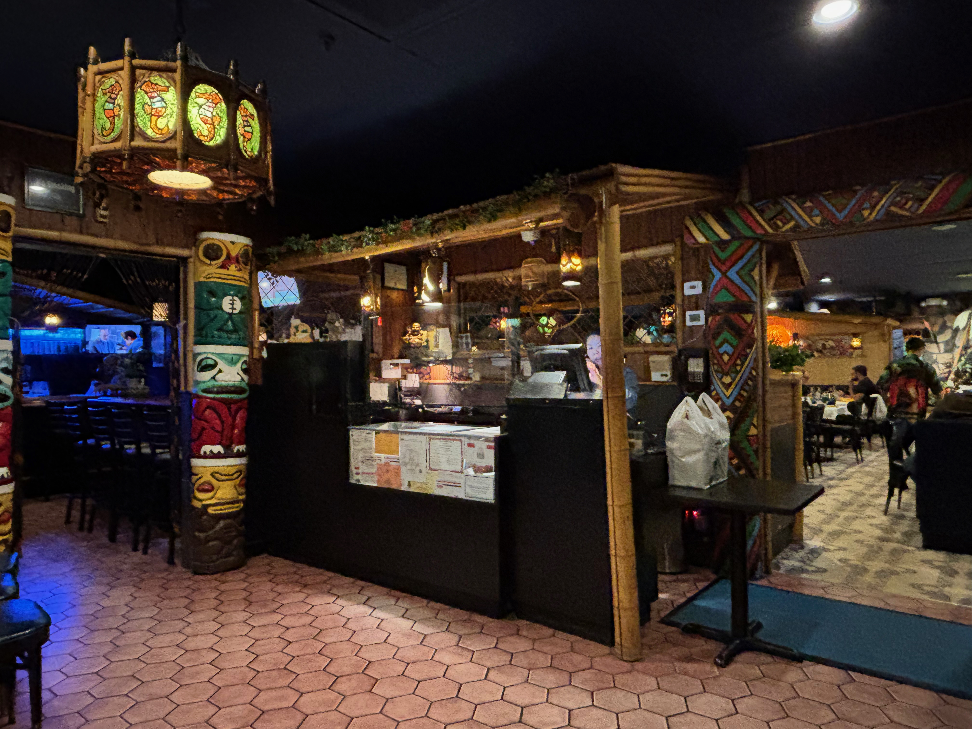 The entry area of Jade Island with tiki-style decor