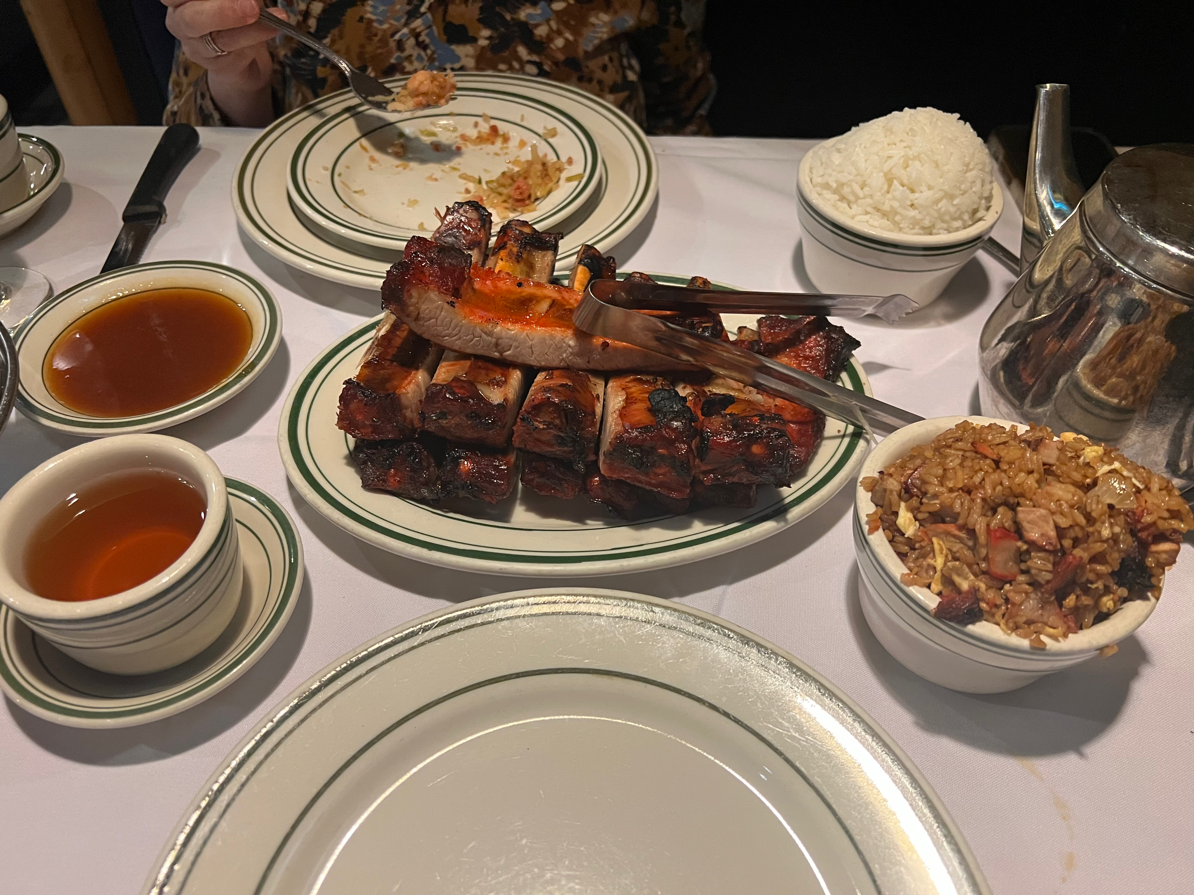 Plate of ribs and fried rice on the table