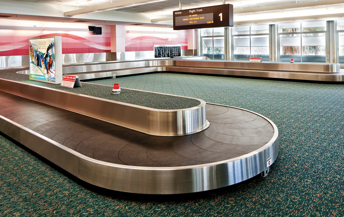 a baggage carousel in an airport