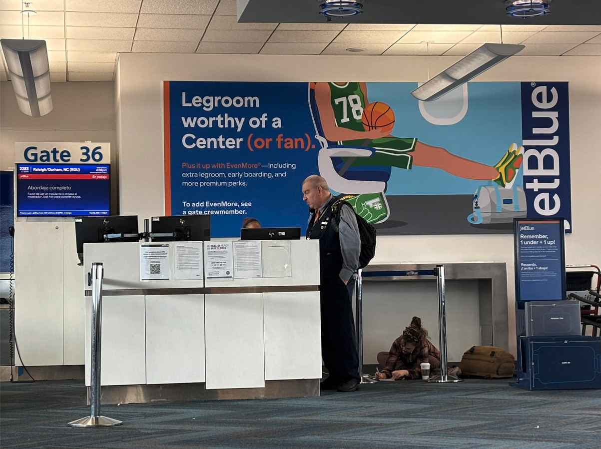 a man standing in front of a desk